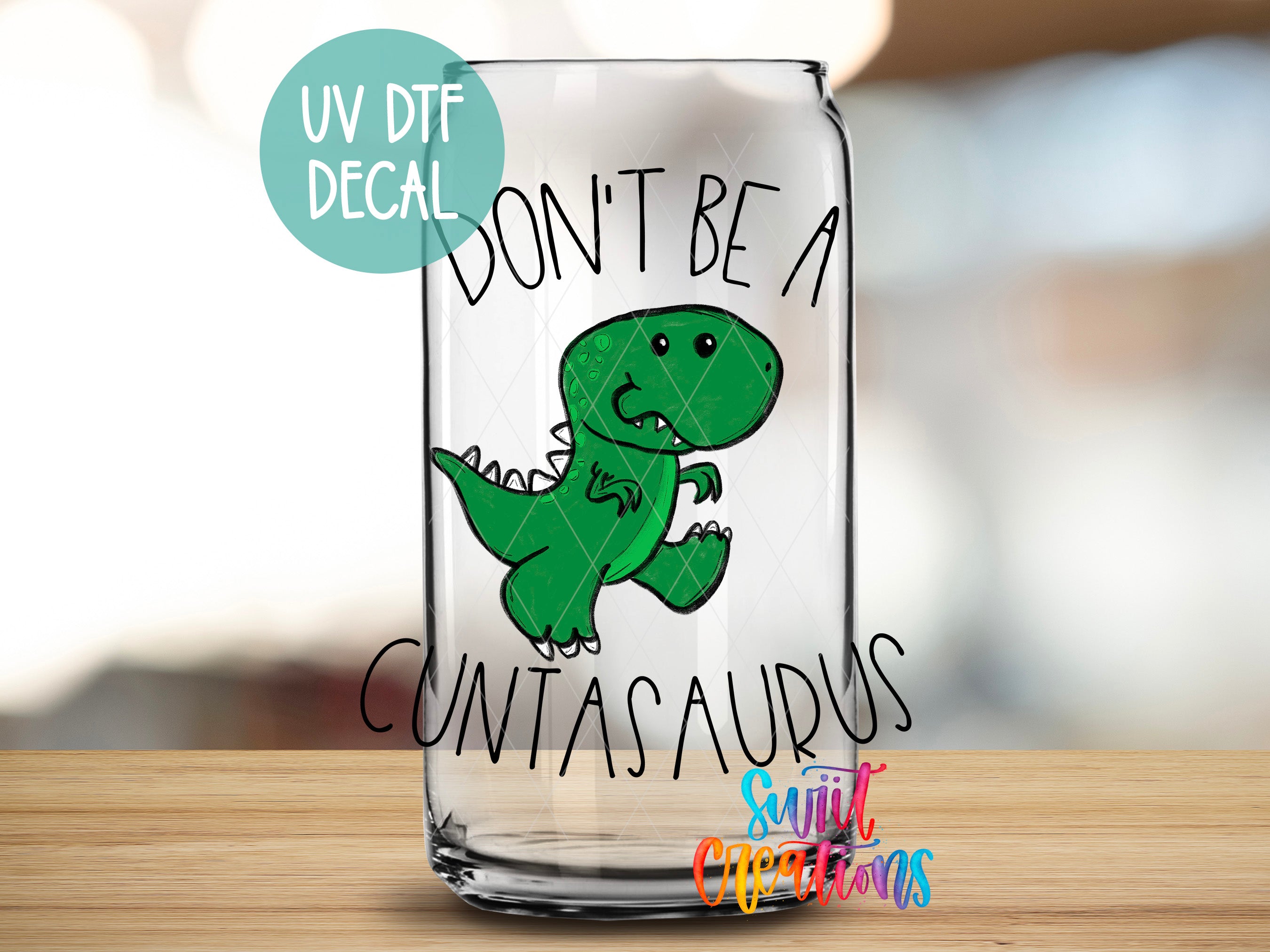 a glass with a picture of a dinosaur on it