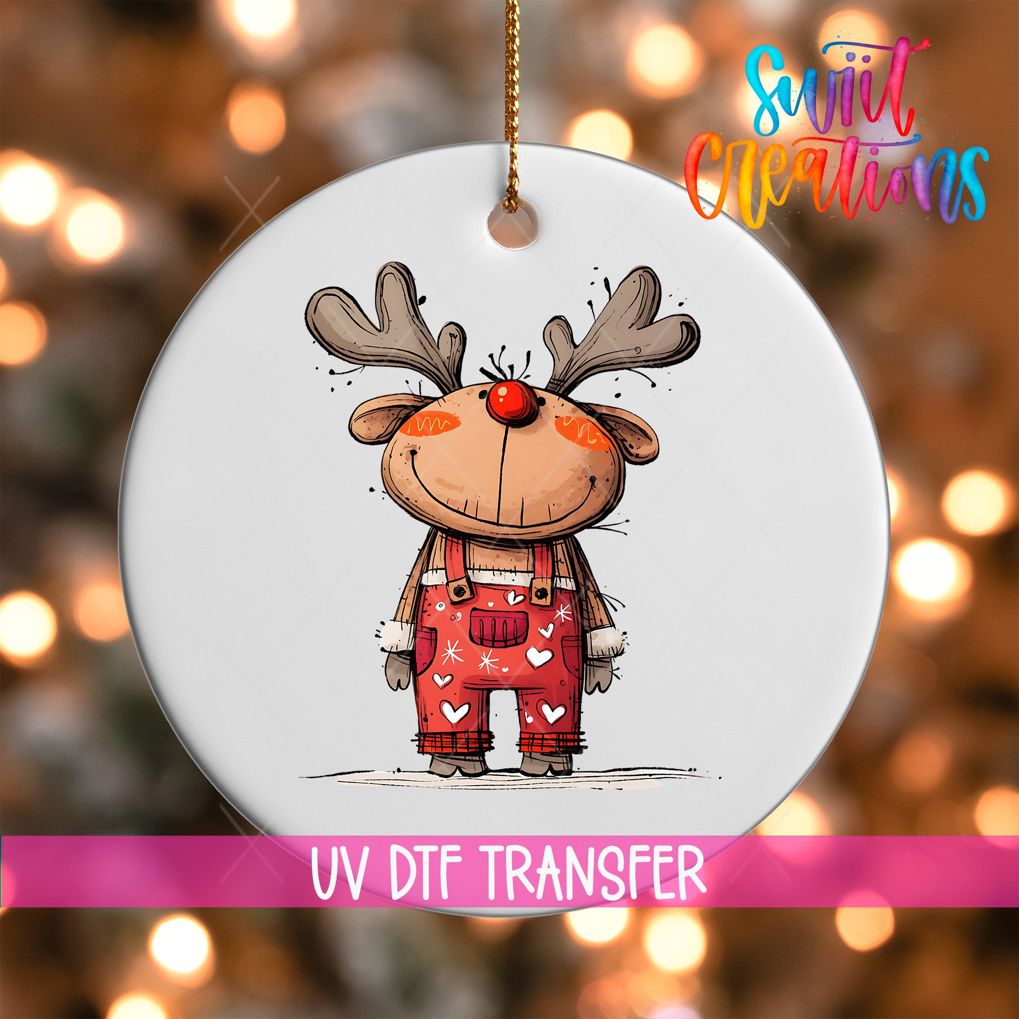 A white ornament with a cartoon reindeer wearing red overalls and a red nose, hanging against a background of colorful lights.