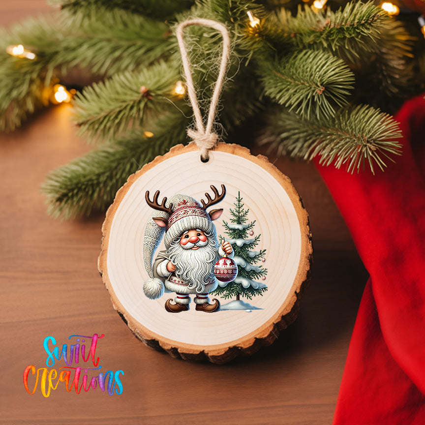 A wooden ornament featuring a Santa Claus figure with antlers, holding a Christmas tree, is hanging on a Christmas tree.