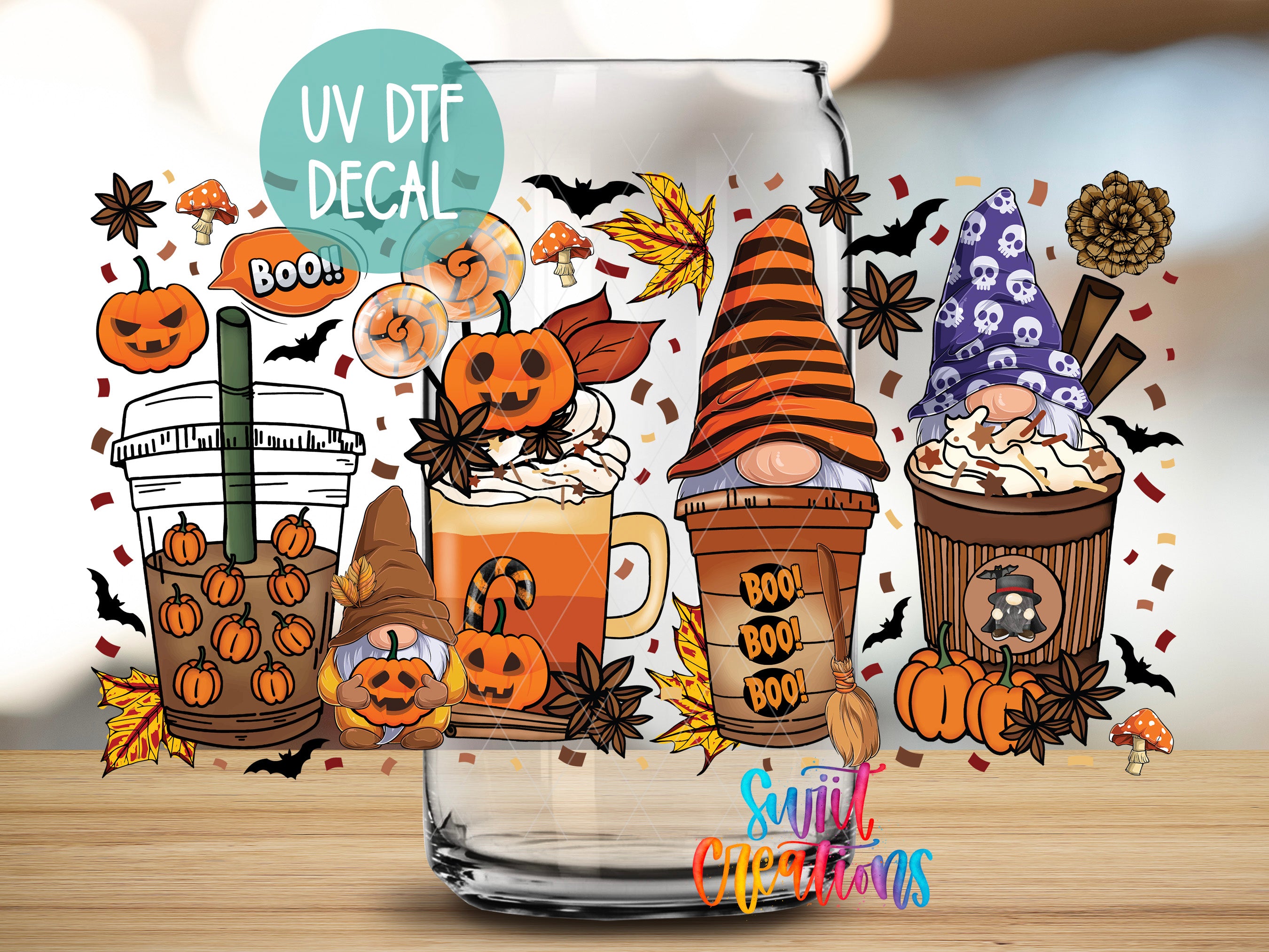 a glass with a picture of a halloween scene in it