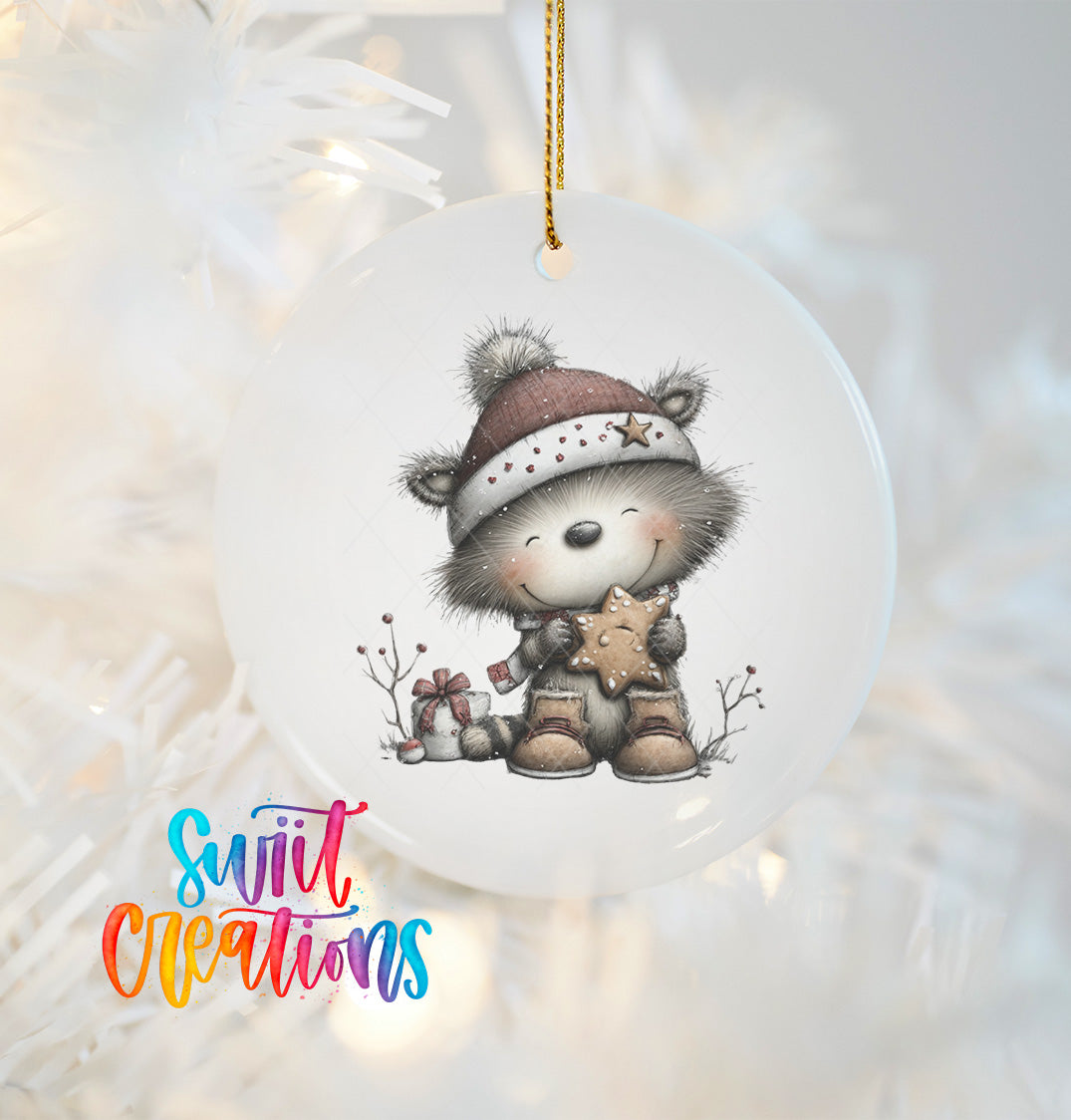 A ceramic ornament featuring a smiling raccoon wearing a hat and holding a star, hanging on a Christmas tree.