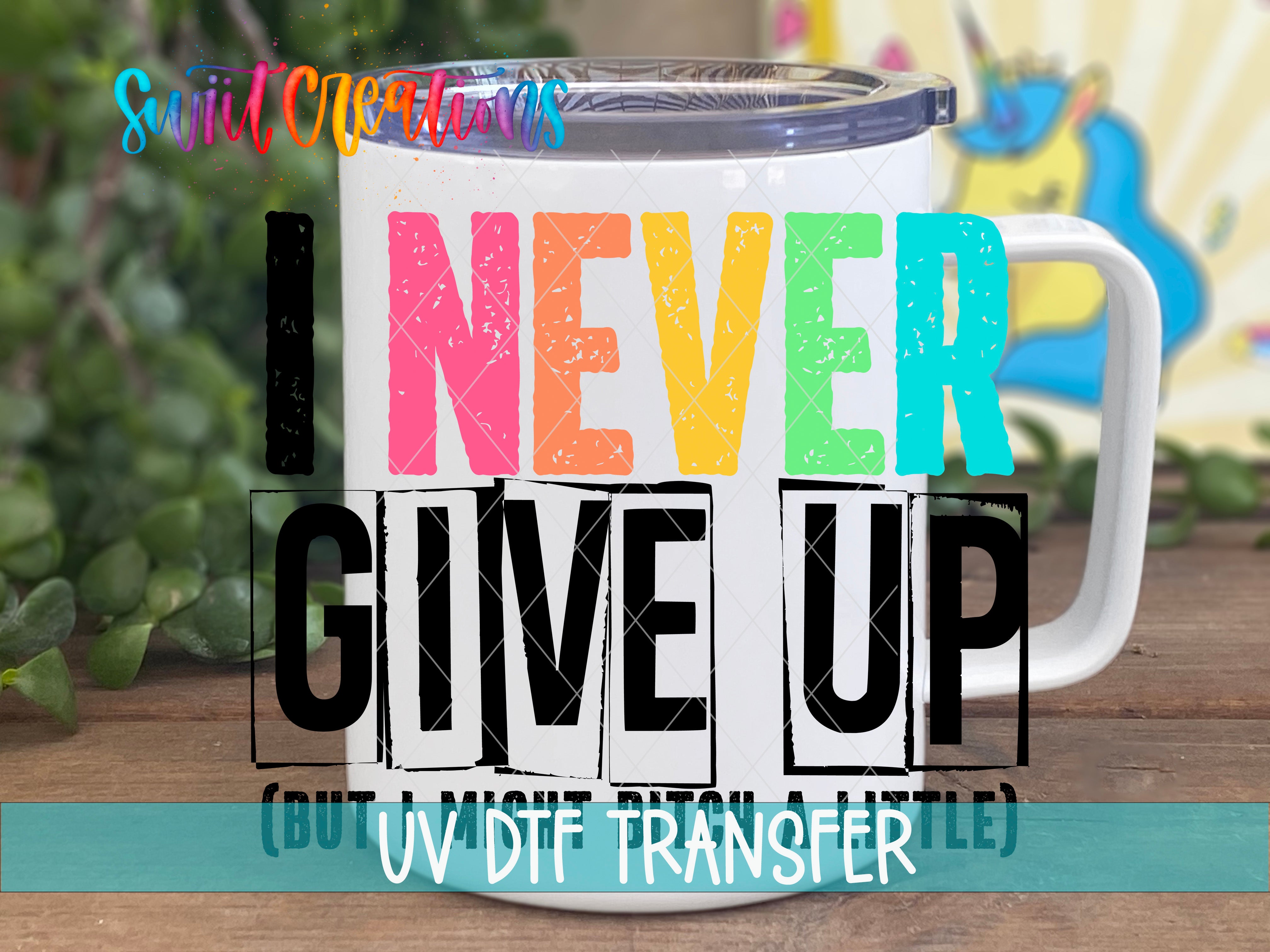 Swiit Creations I Never Give Up UV DTF transfer displayed on a white coffee mug