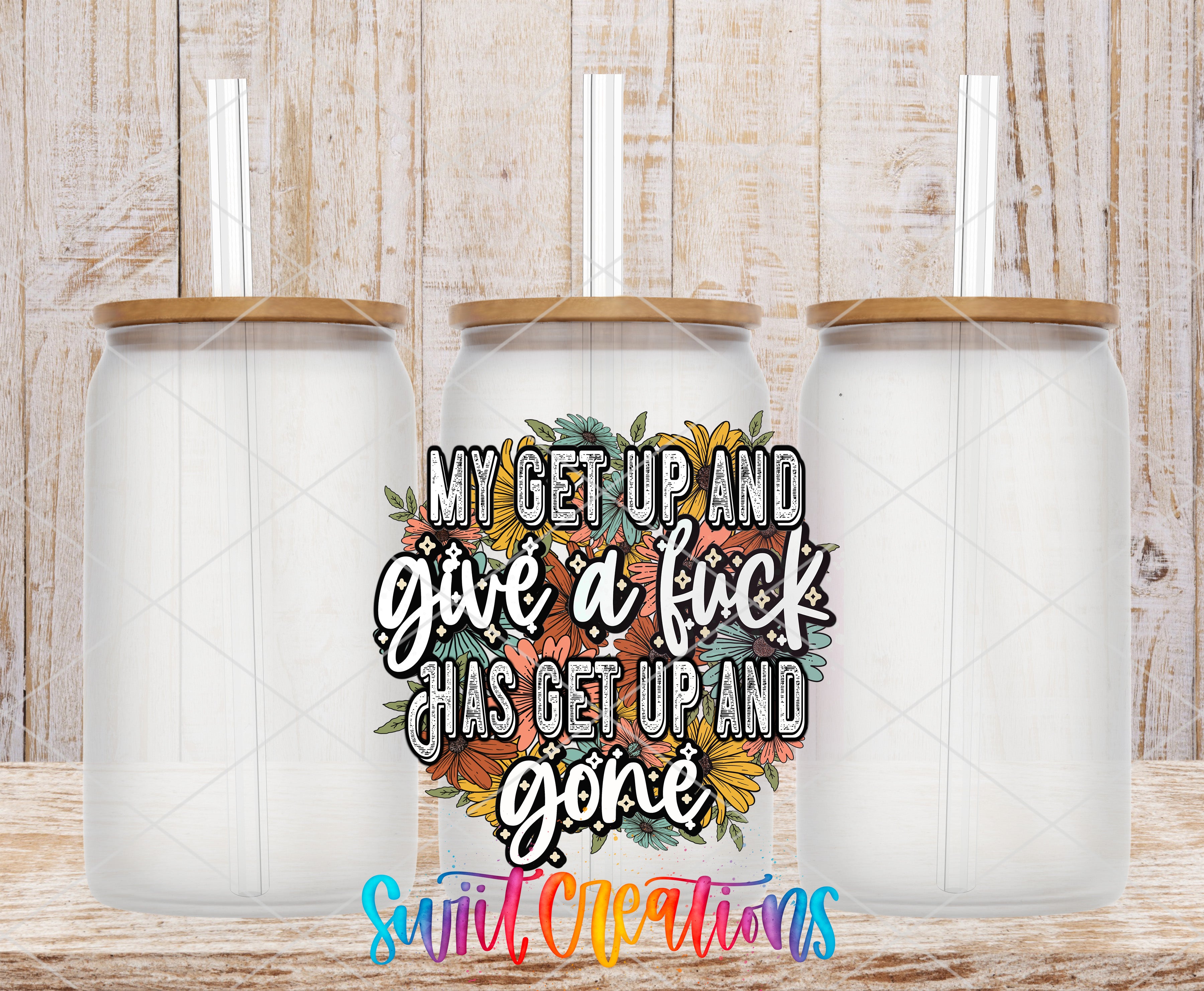 Swiit Creations UV DTF Get Up and Give a Fuck transfer shown on a clear glass can set