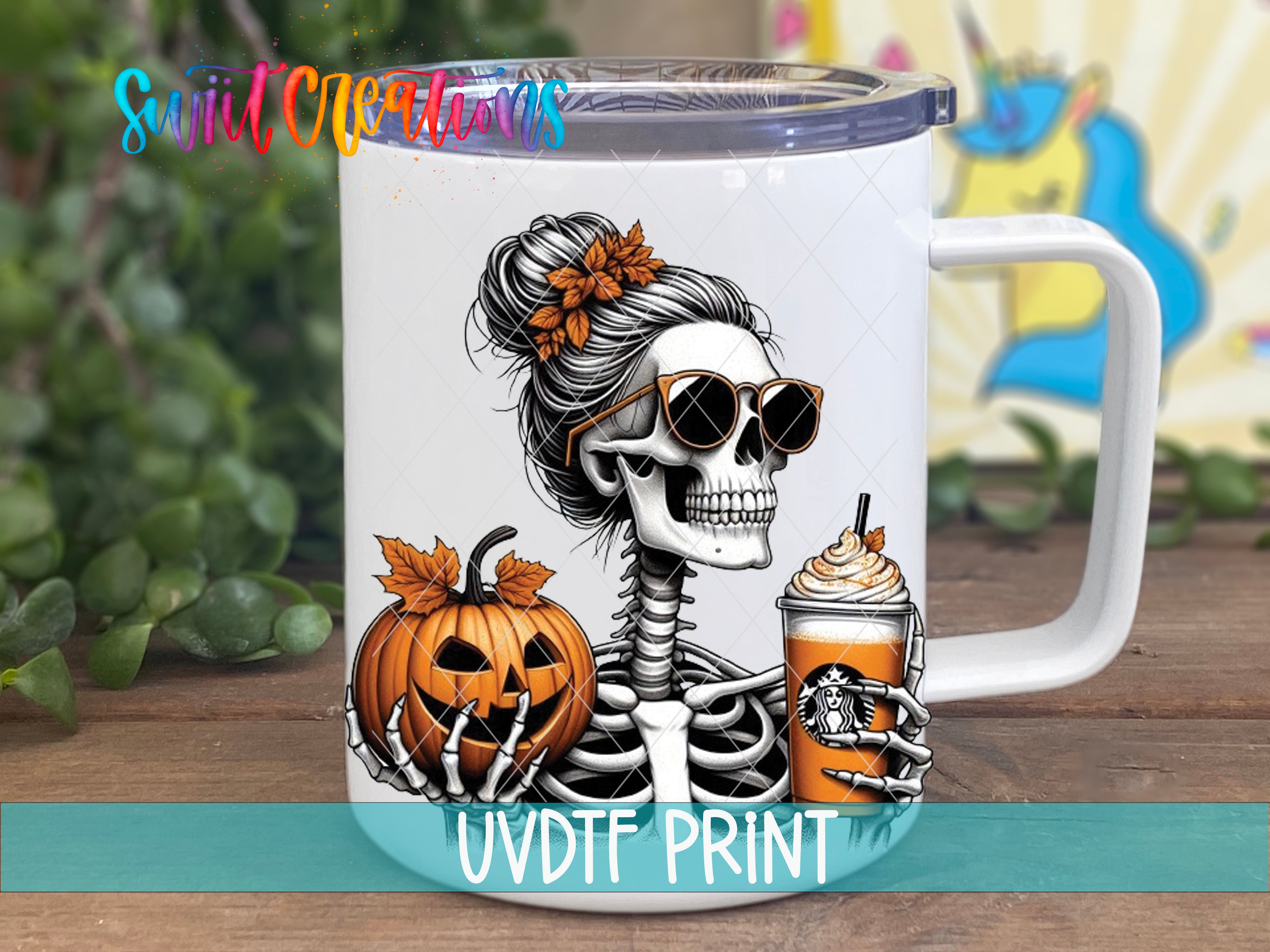 a white coffee mug with a skeleton holding a drink