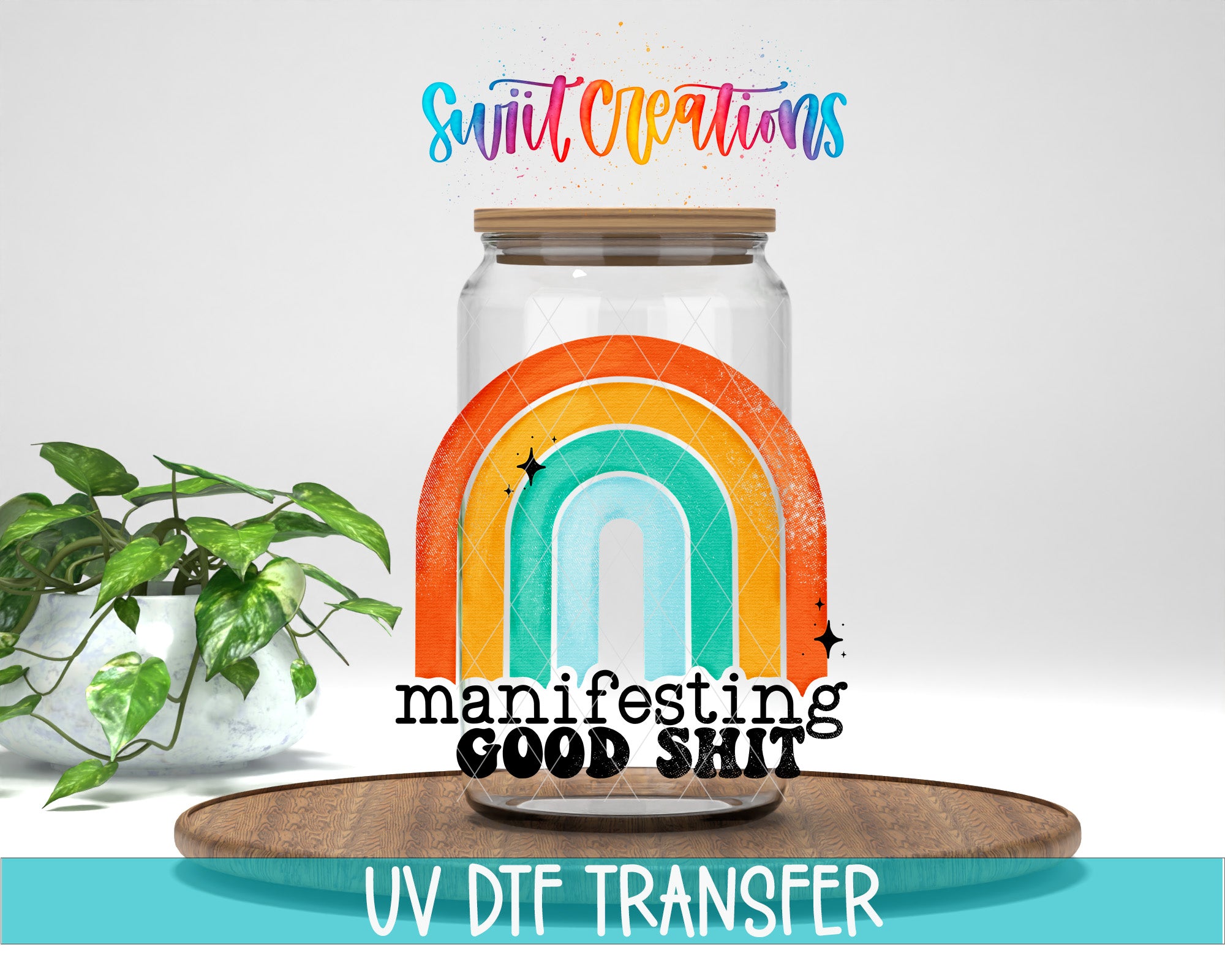 a glass jar with a rainbow design, placed on a wooden surface. The jar has a lid and is surrounded by a potted plant. The text overlay on the image includes the words "Manifesting Good Shit" and "UV Dtf Transfer".