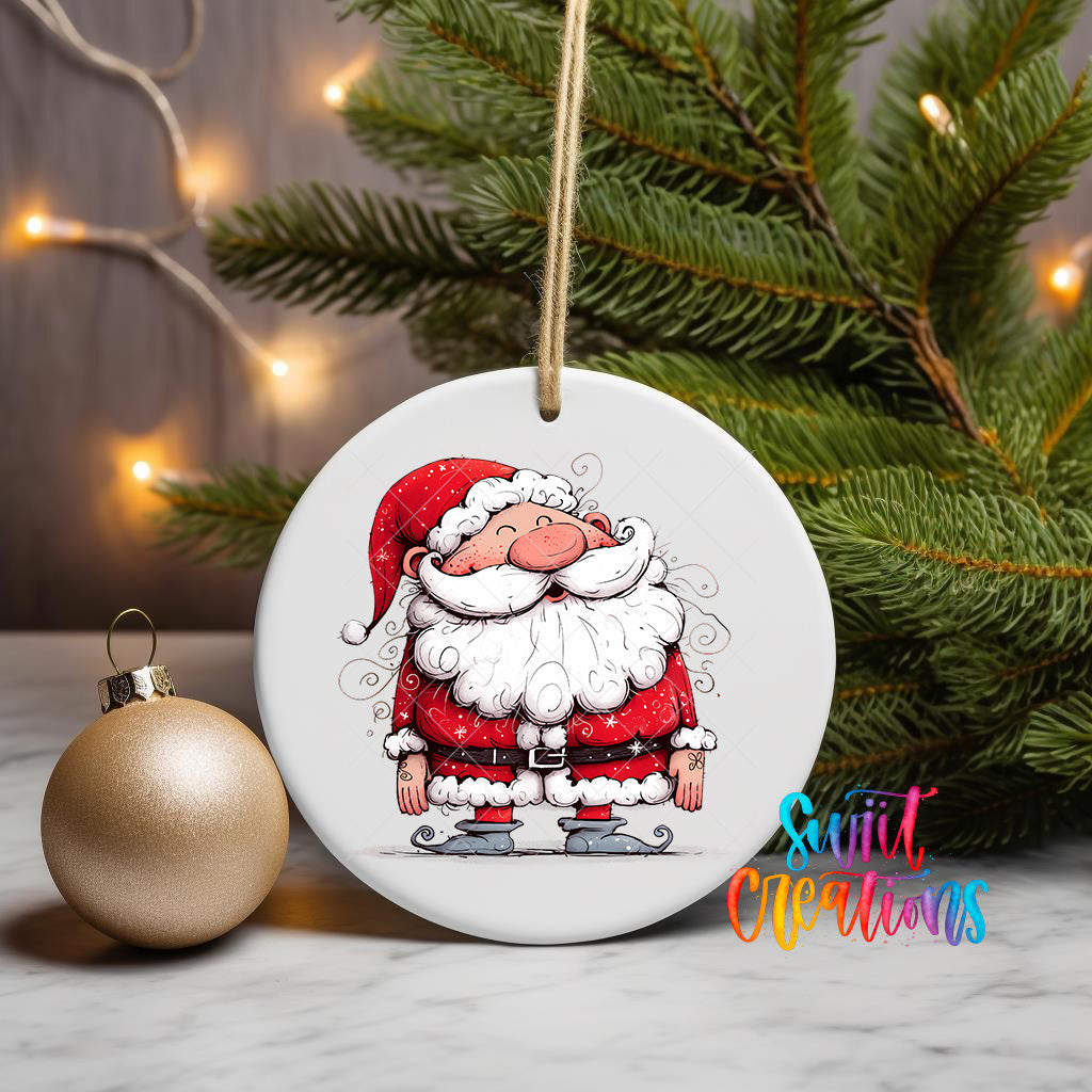 A white ceramic ornament featuring a cartoon Santa Claus figure is displayed on a marble surface, with a gold ornament and a Christmas tree in the background.