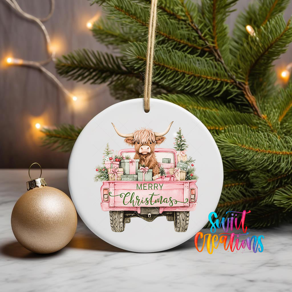 A white ceramic ornament with a pink truck and a cow illustration, along with the text "MERRY CHRISTMAS" and "Sweet Creations" on a Christmas tree.