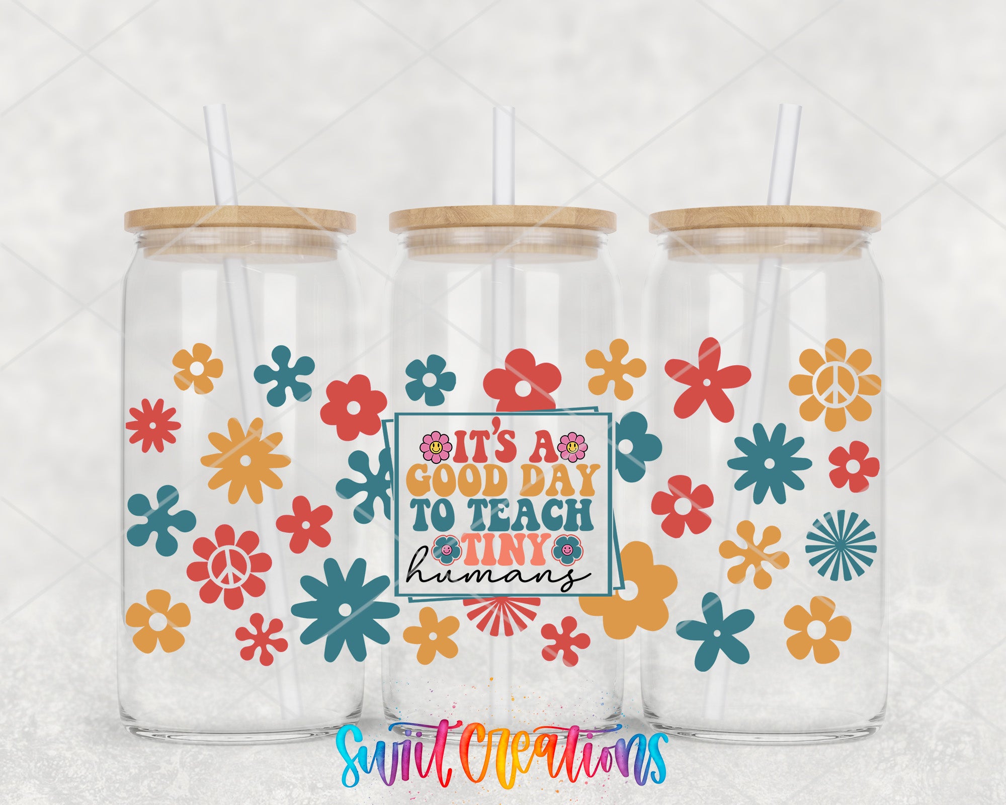 three clear glass tumblers with colorful flower designs on them, each with a straw lid. In the center of the image, there is a sign that reads "It's a good day to teach tiny humans".