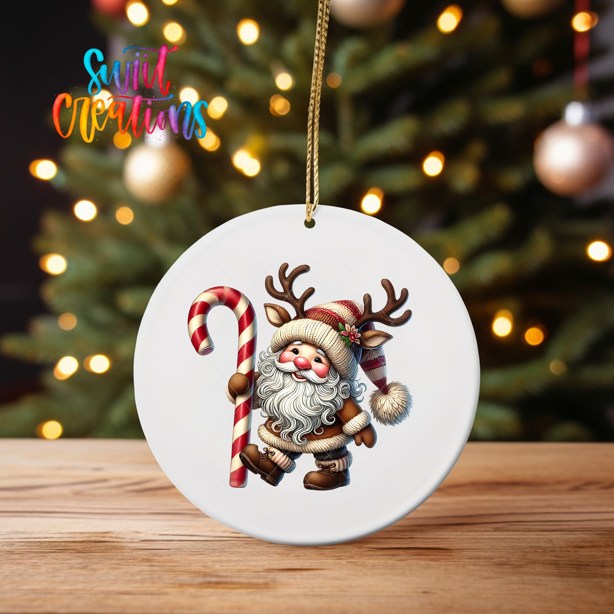 A white ornament featuring a cartoon Santa Claus holding a candy cane and reindeer antlers, with a blurred background of a Christmas tree and colorful lights.