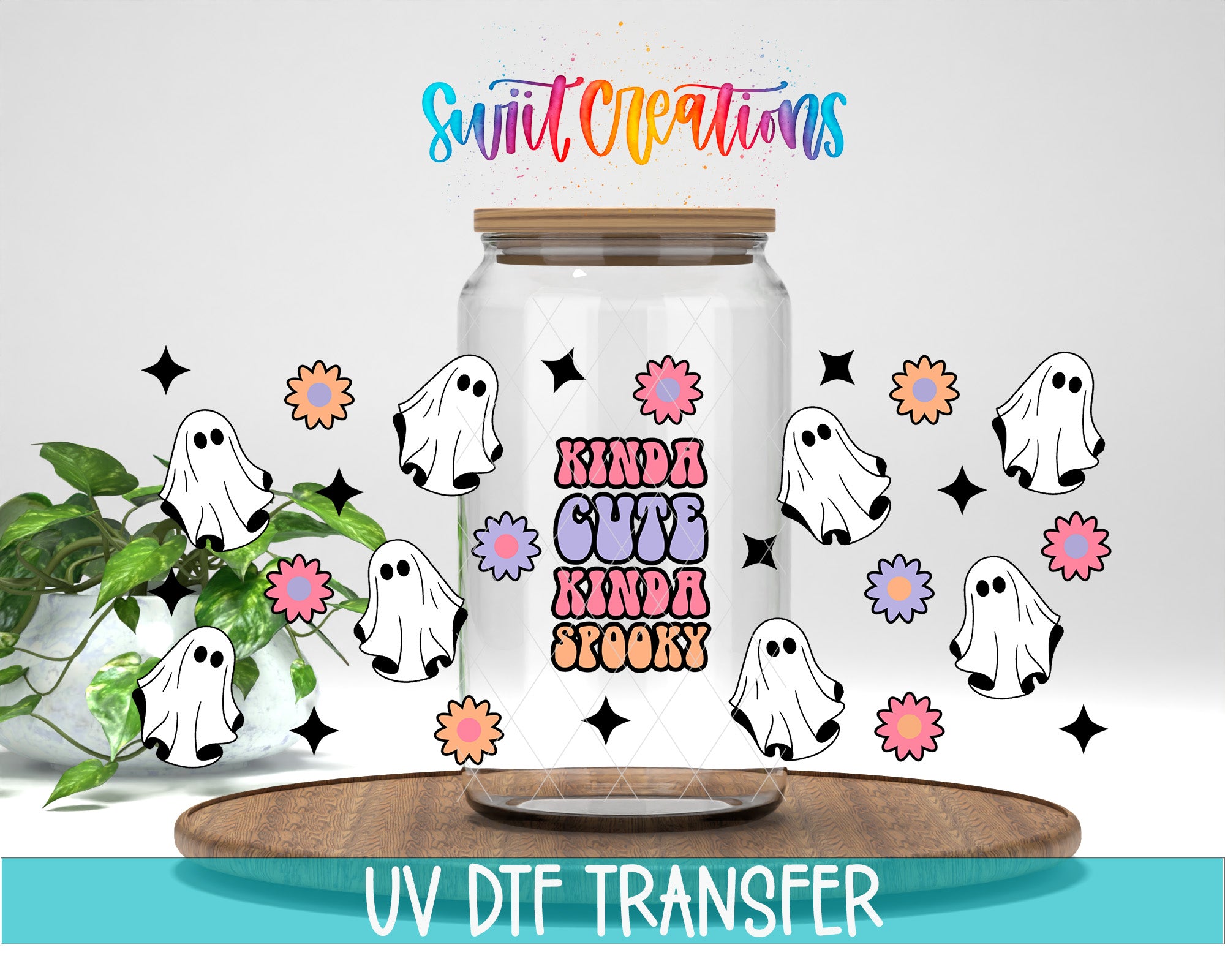 a clear glass jar with a label that says "Kinda Cute Kinda Spooky" surrounded by various ghost-like illustrations and flowers. The jar is placed on a wooden surface, and there is a plant in the background. The image also includes text that says "Swit Creations" and "UV Dtf Transfer".