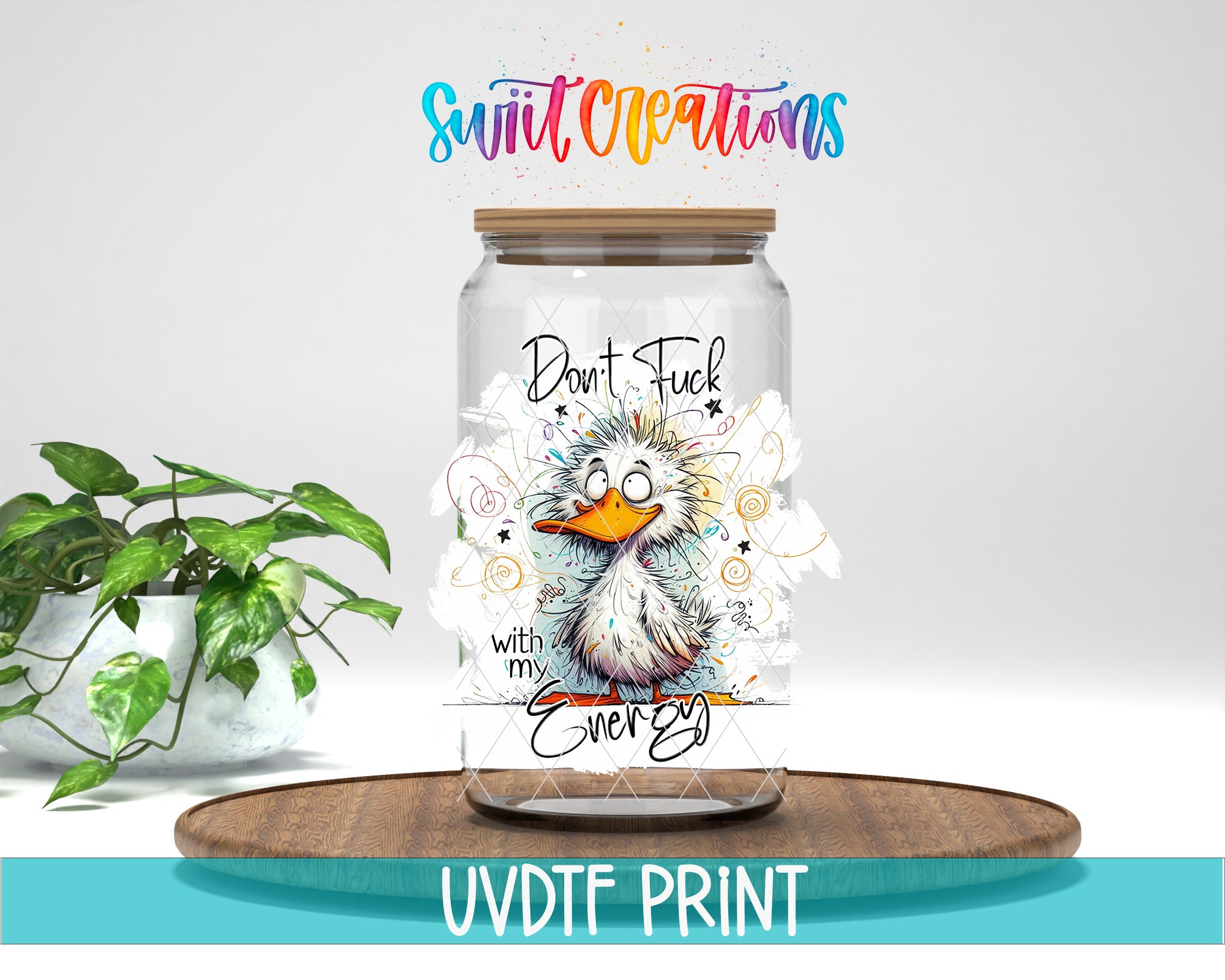 a glass jar with a cartoon duck on it, placed on a wooden surface. The jar has a label with a message that says "Don't Fuck with my Energy". There is also a plant in the background.