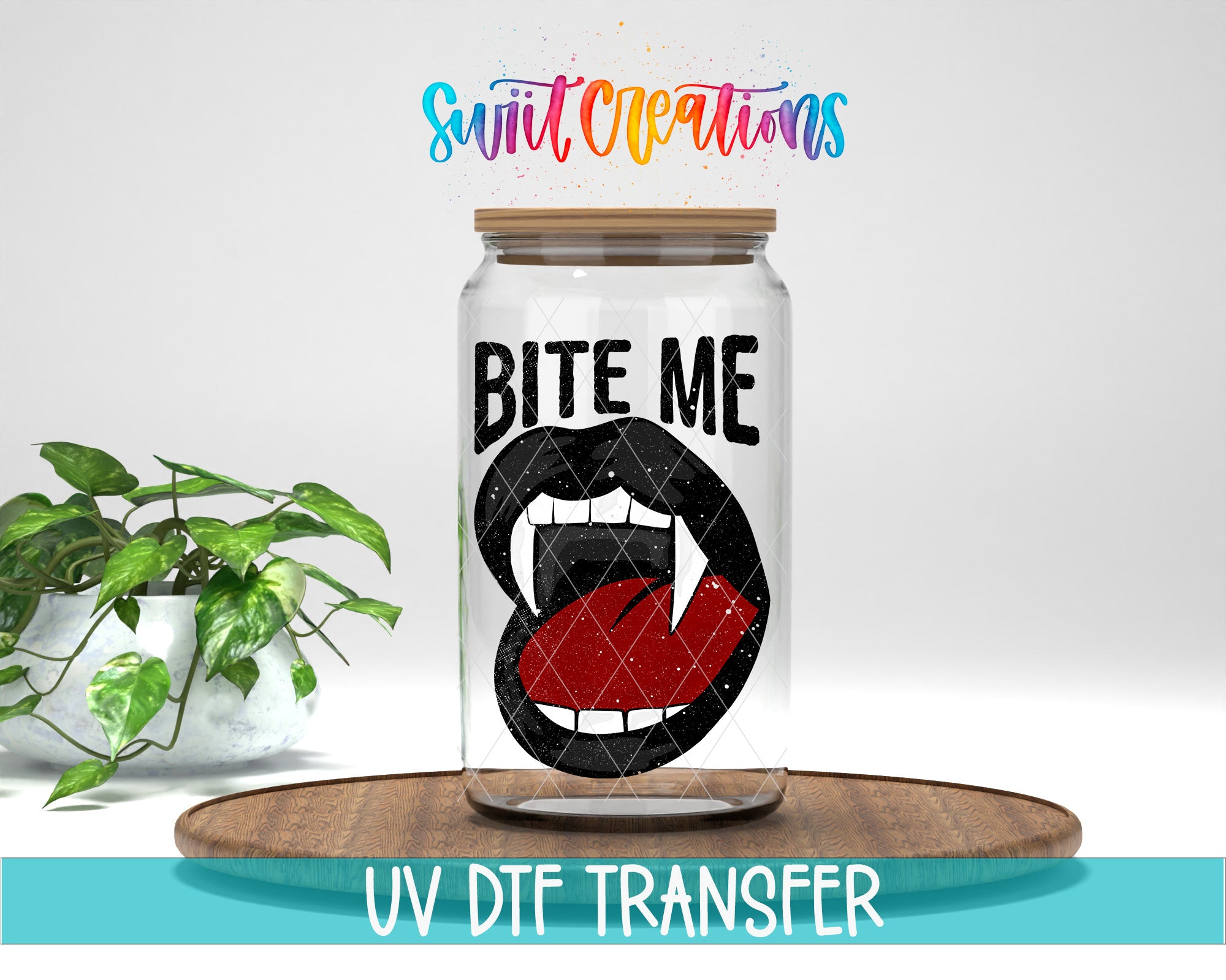 a glass jar with a graphic of a mouth with fangs and the text "BITE ME" inside it, placed on a wooden surface. There is also a potted plant in the background.