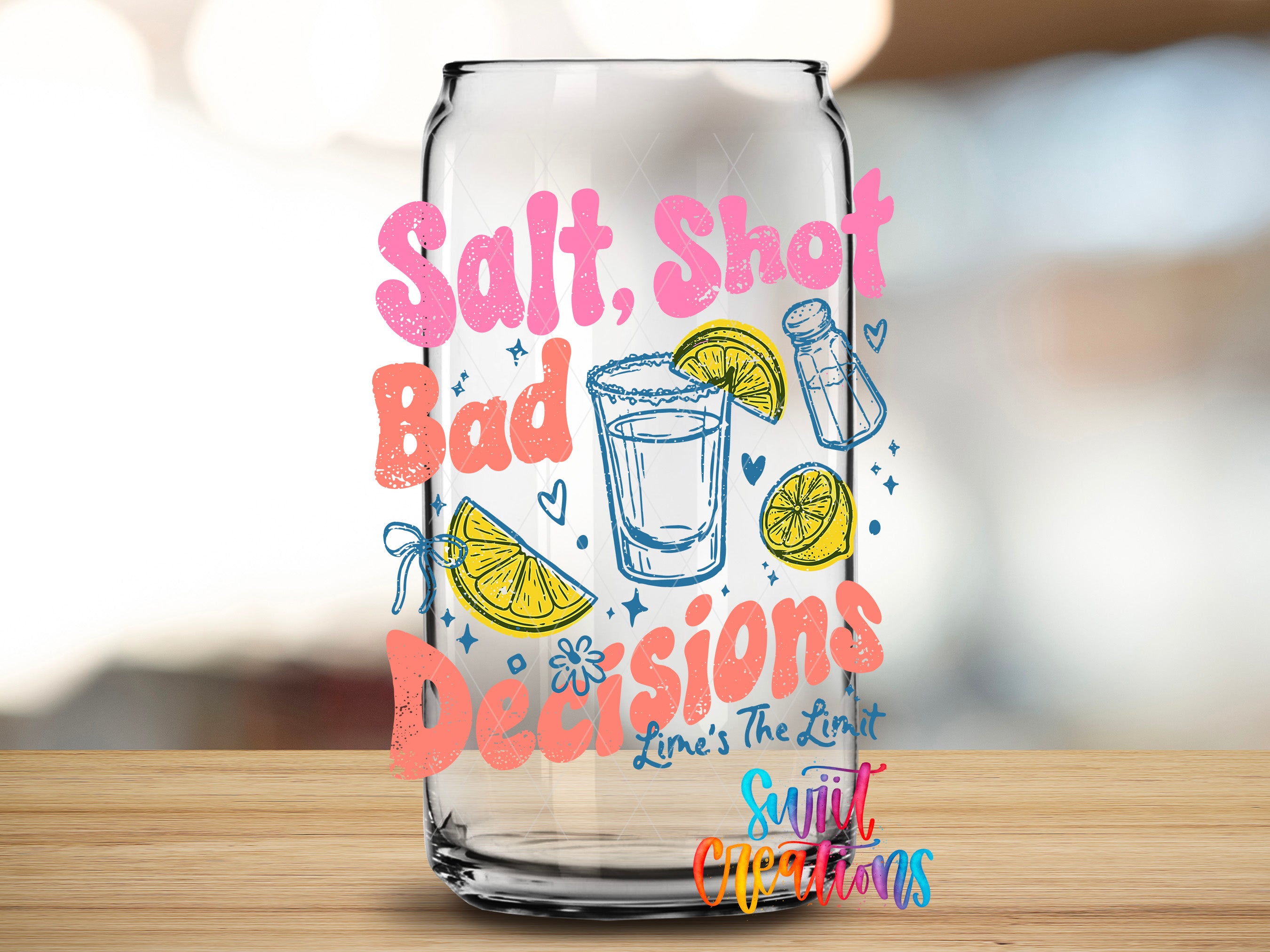 A glass with a colorful design featuring text and illustrations related to "Salt, Shot, Bad Decisions" and "Line's The Limit".