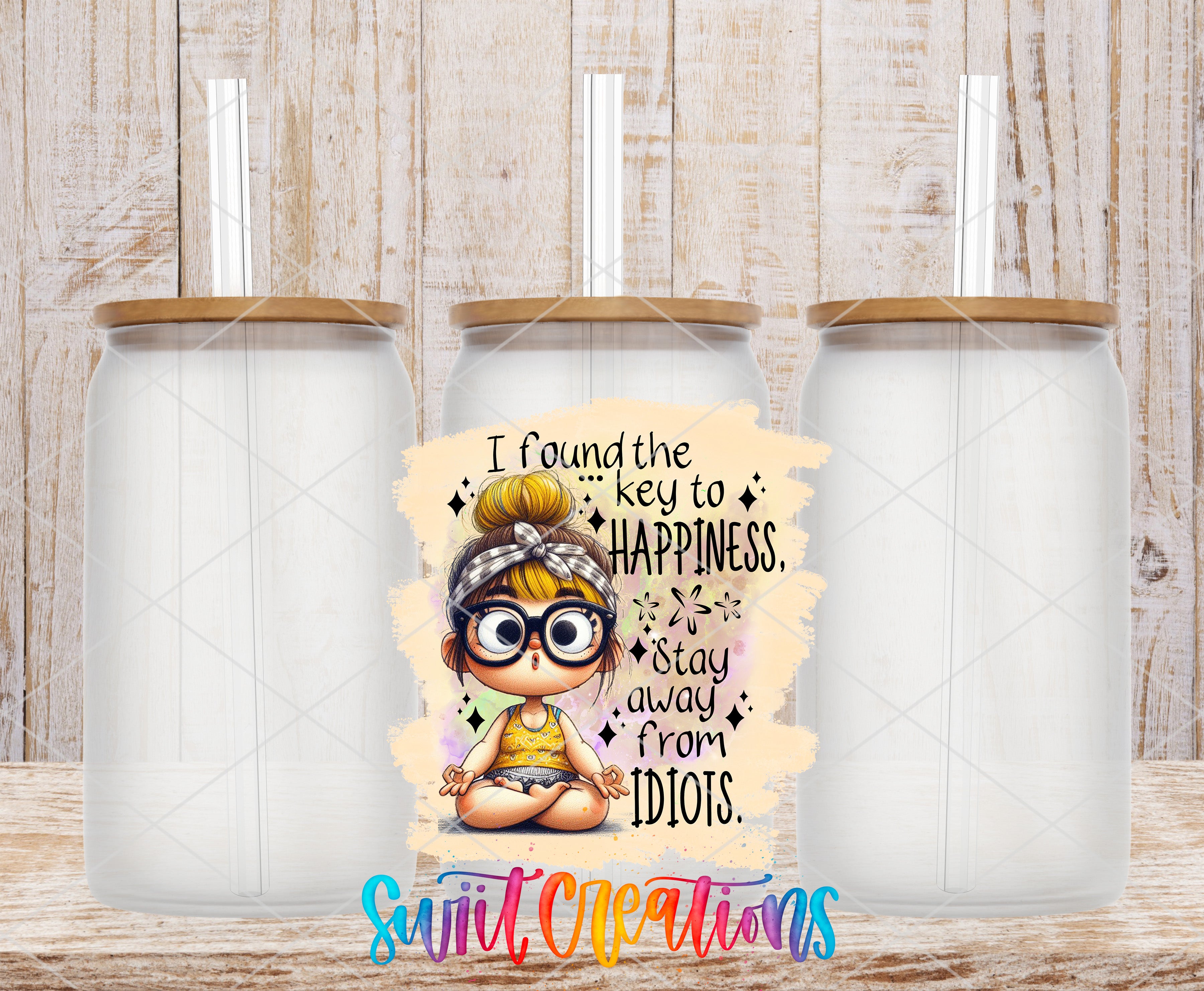 a cartoon illustration of a young girl with glasses and a headband, accompanied by text that reads "I found the key to happiness. Stay away from Idiot's." The image is set against a wooden background, and there are three identical glass jars or containers placed in front of it.