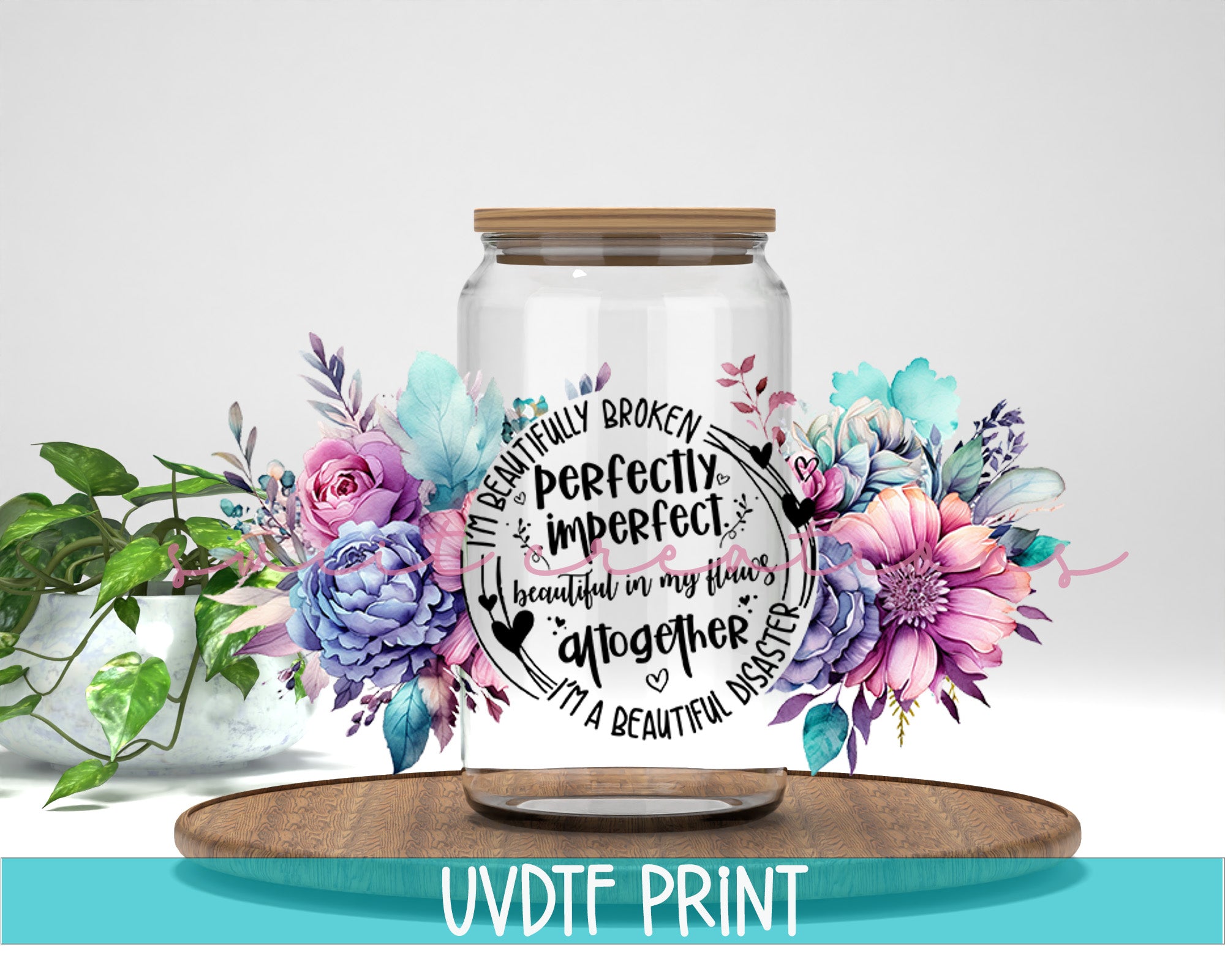 a jar with flowers and a quote on it