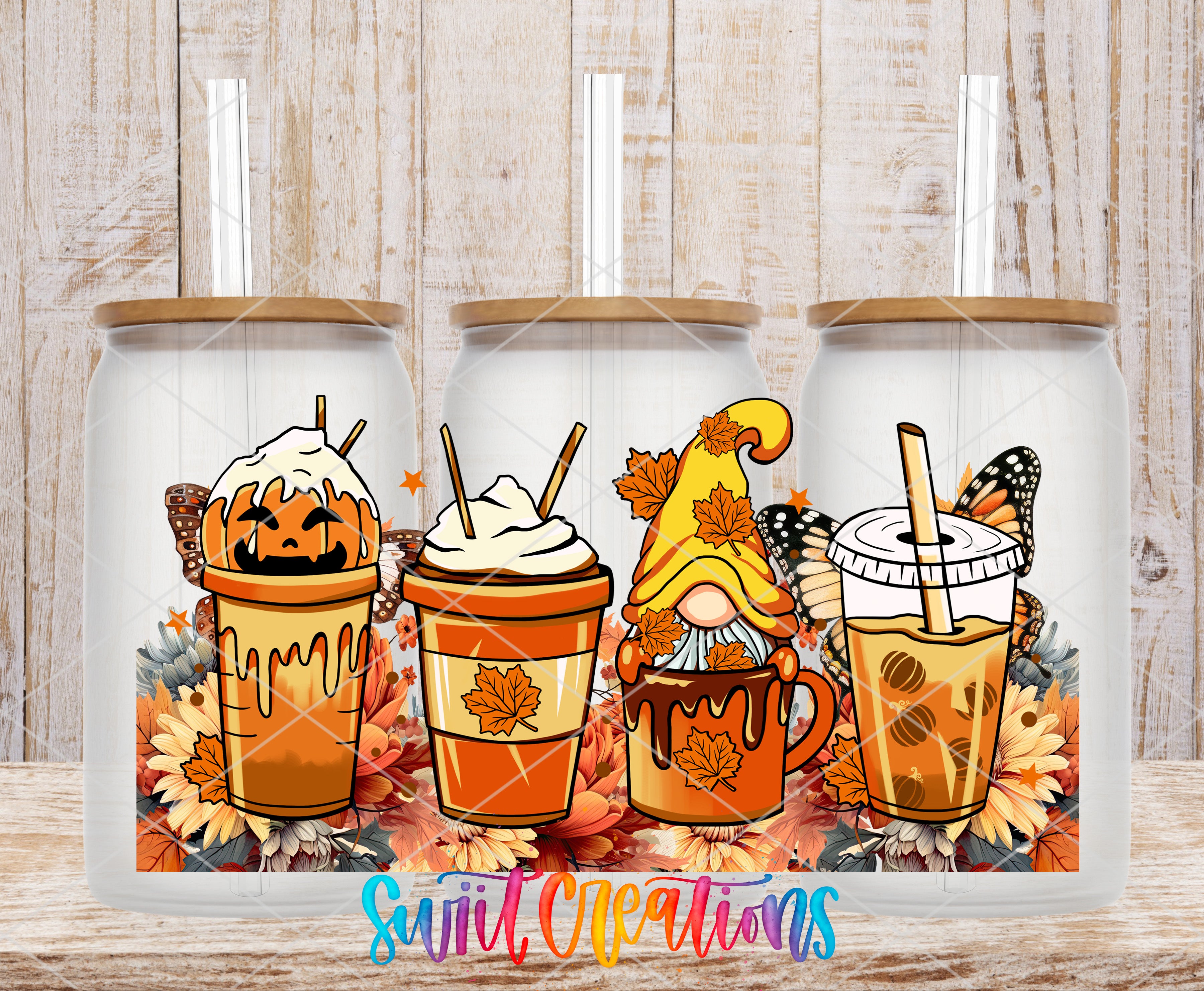 three glass jars with illustrations of autumn-themed beverages, including a pumpkin-shaped drink, a coffee drink with a gnome, and a hot chocolate drink with a butterfly.
