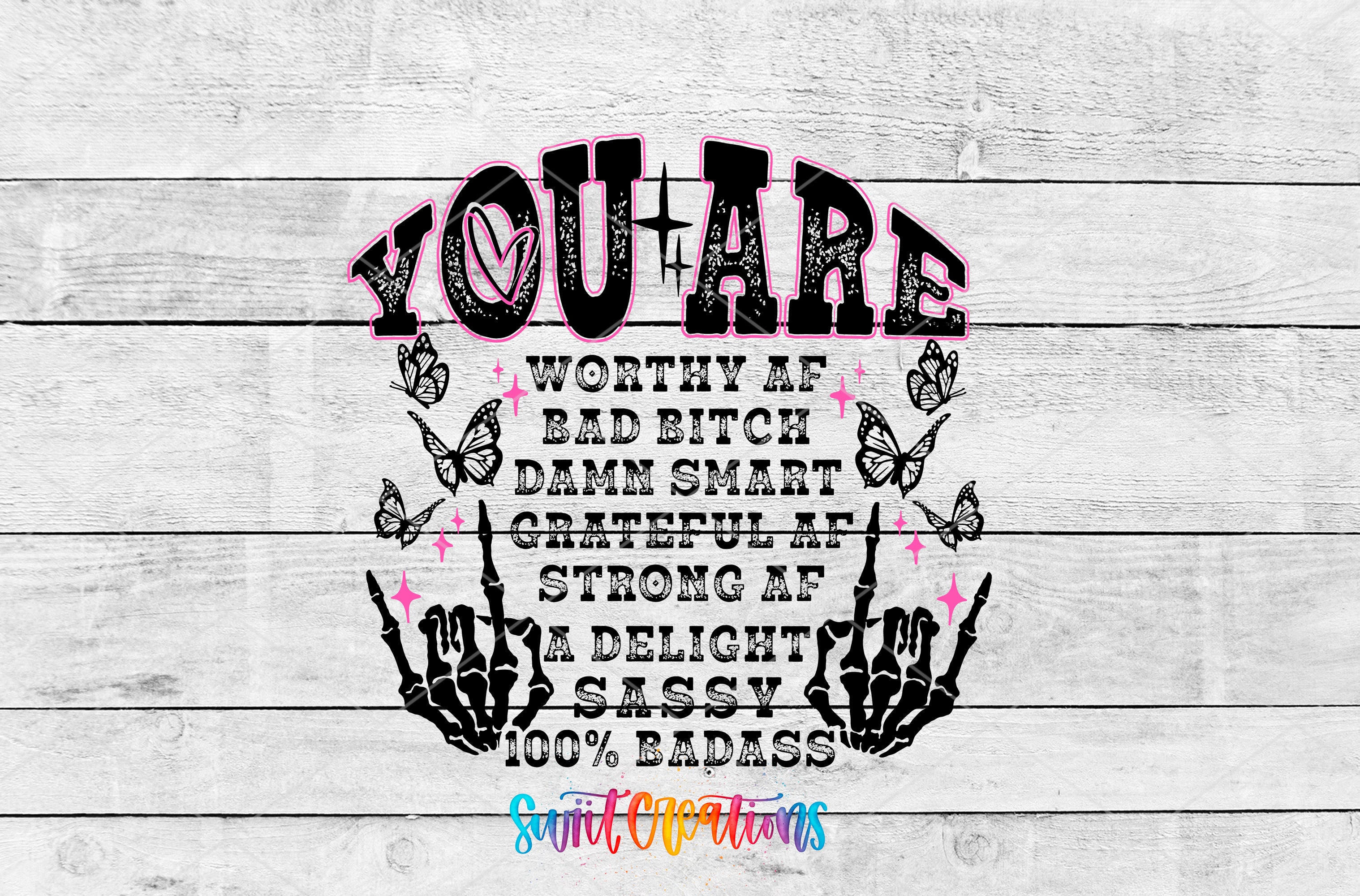a graphic design with the text "YOU ARE WORTHY AF BAD BITCH DAMN SMART GRATEFUL AT STRONG AF DELIGHT SASSY 100% BAD" surrounded by various symbols such as butterflies and skeletal hands.