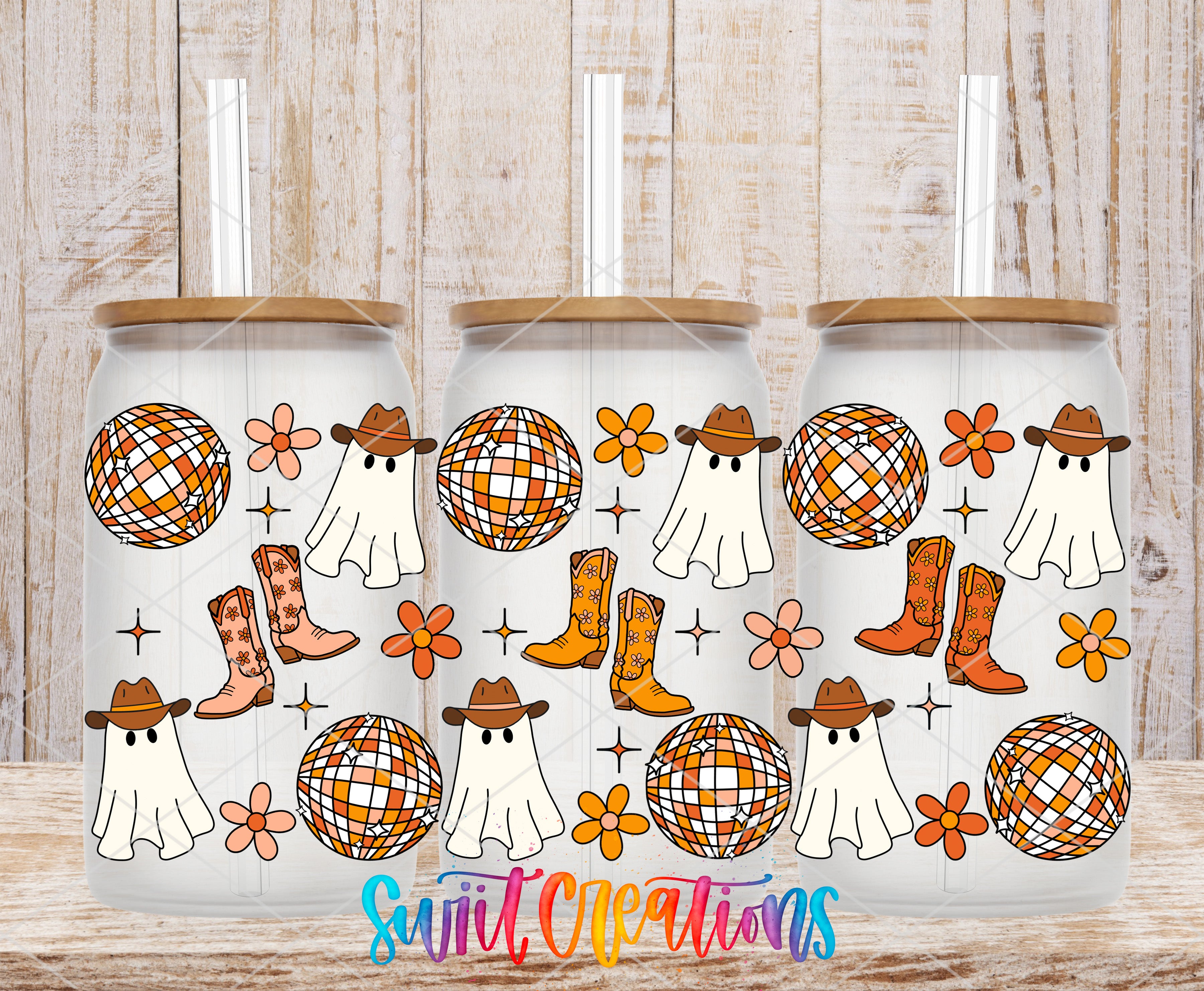 three glass tumblers with a Halloween-themed design on them. The design includes ghostly figures, disco balls, cowboy boots, and flowers.