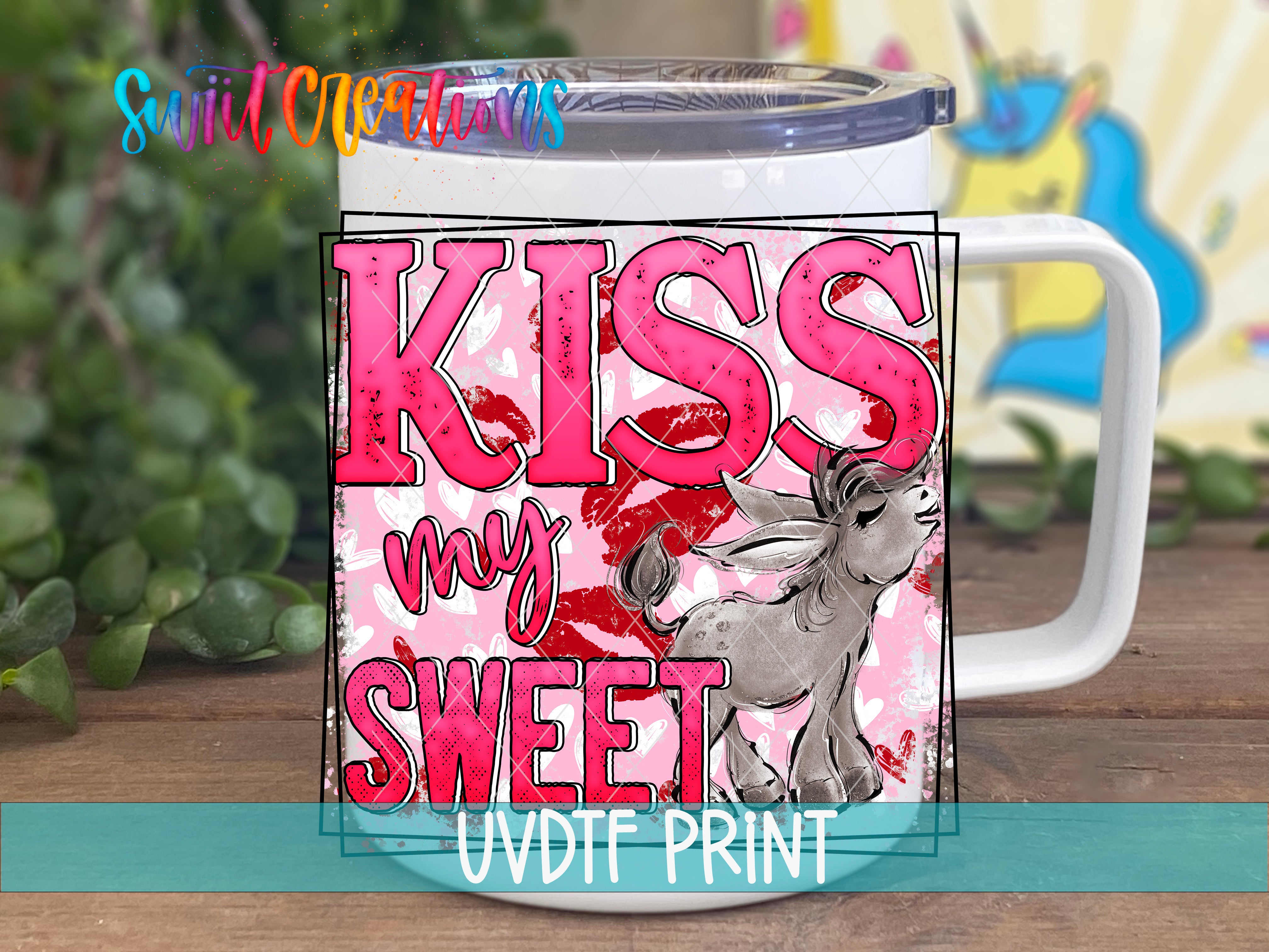 a coffee mug with the words kiss my sweet on it