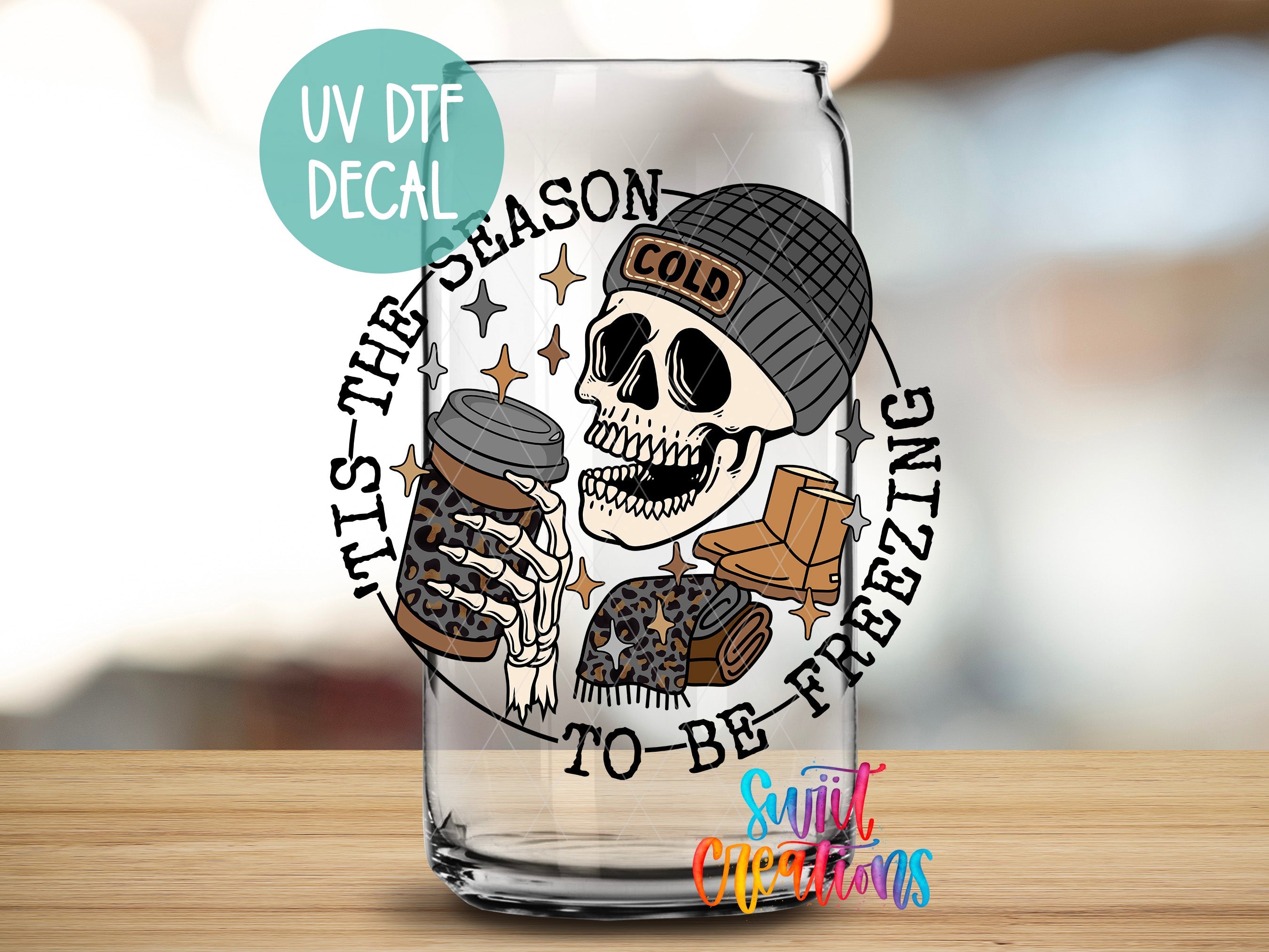 a shot glass with a skull holding a jar of cookies