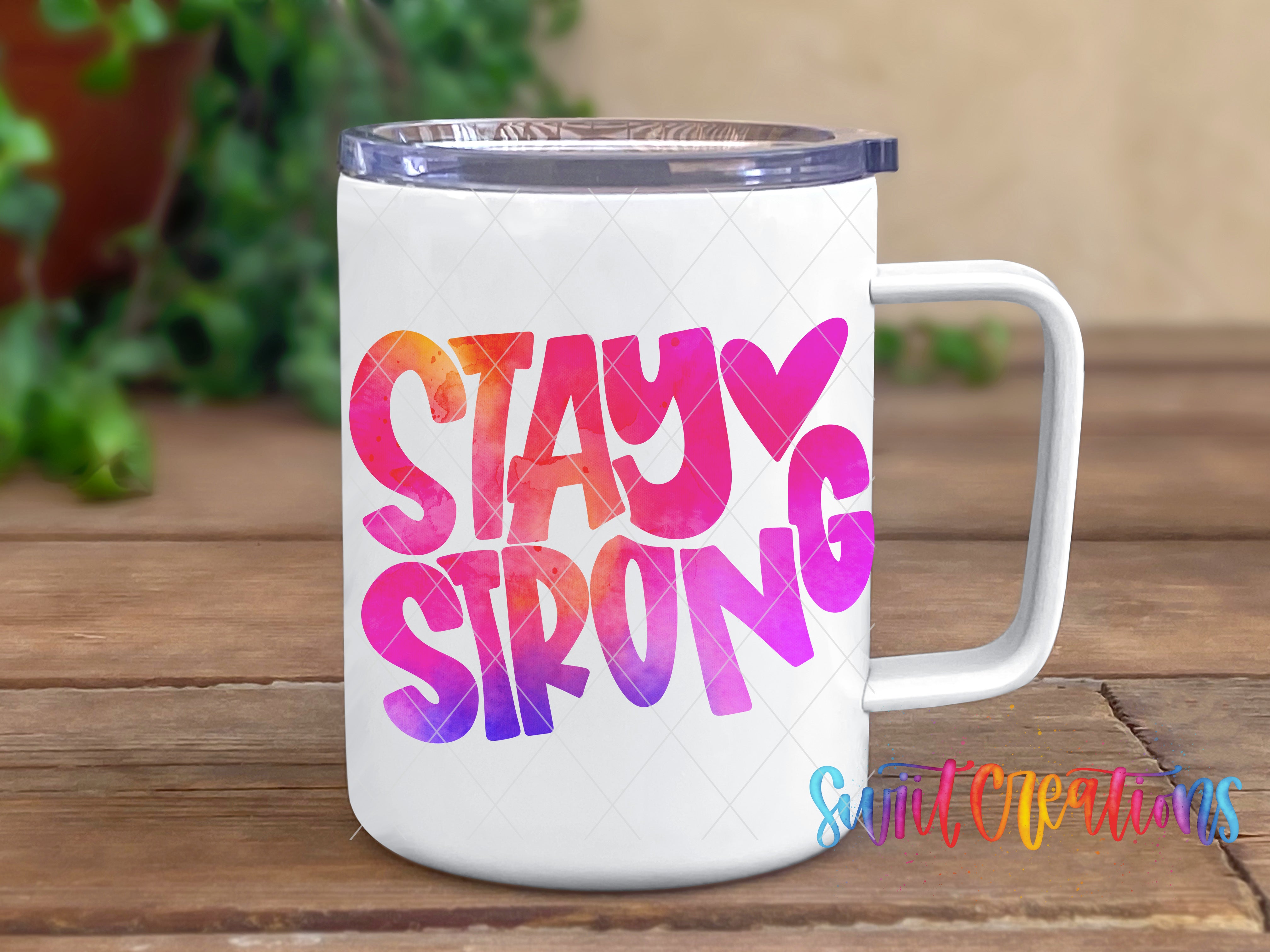 a white coffee mug with the words stay strong on it