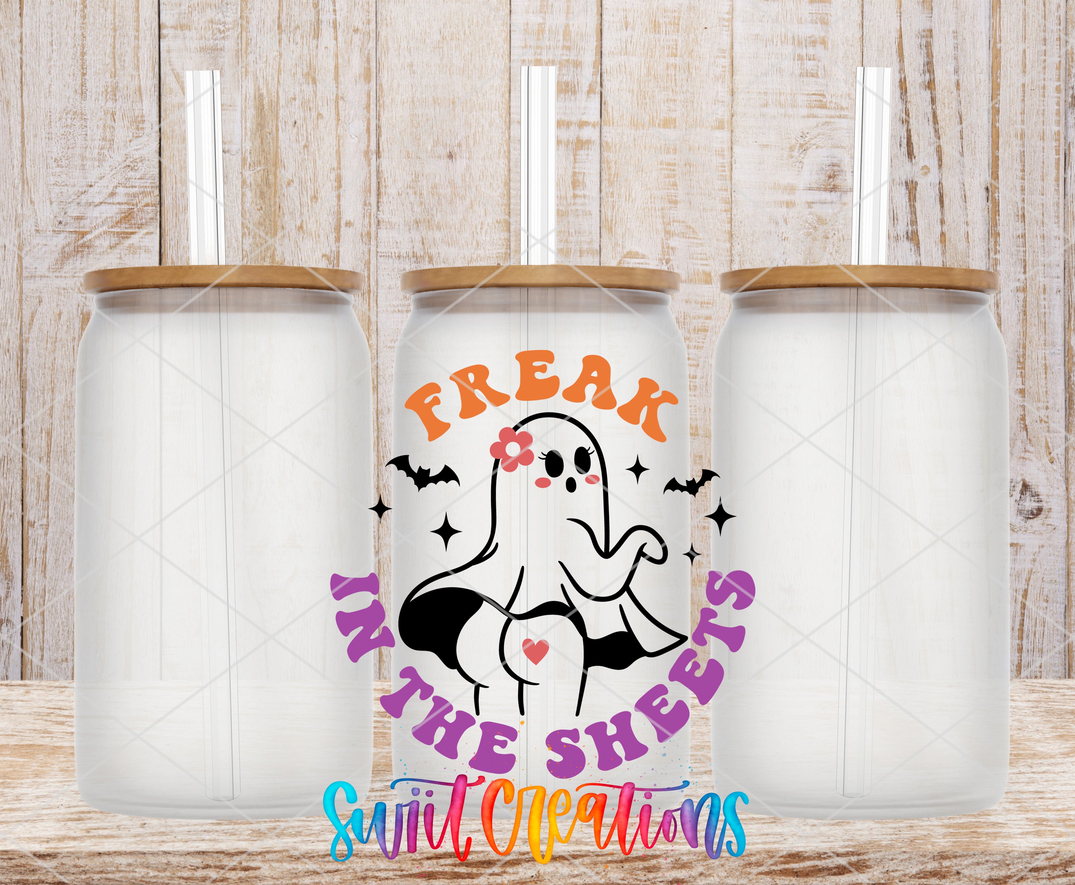 Swiit Creations UV DTF Freak In The Sheets Sassy Halloween transfer shown on a clear glass can set