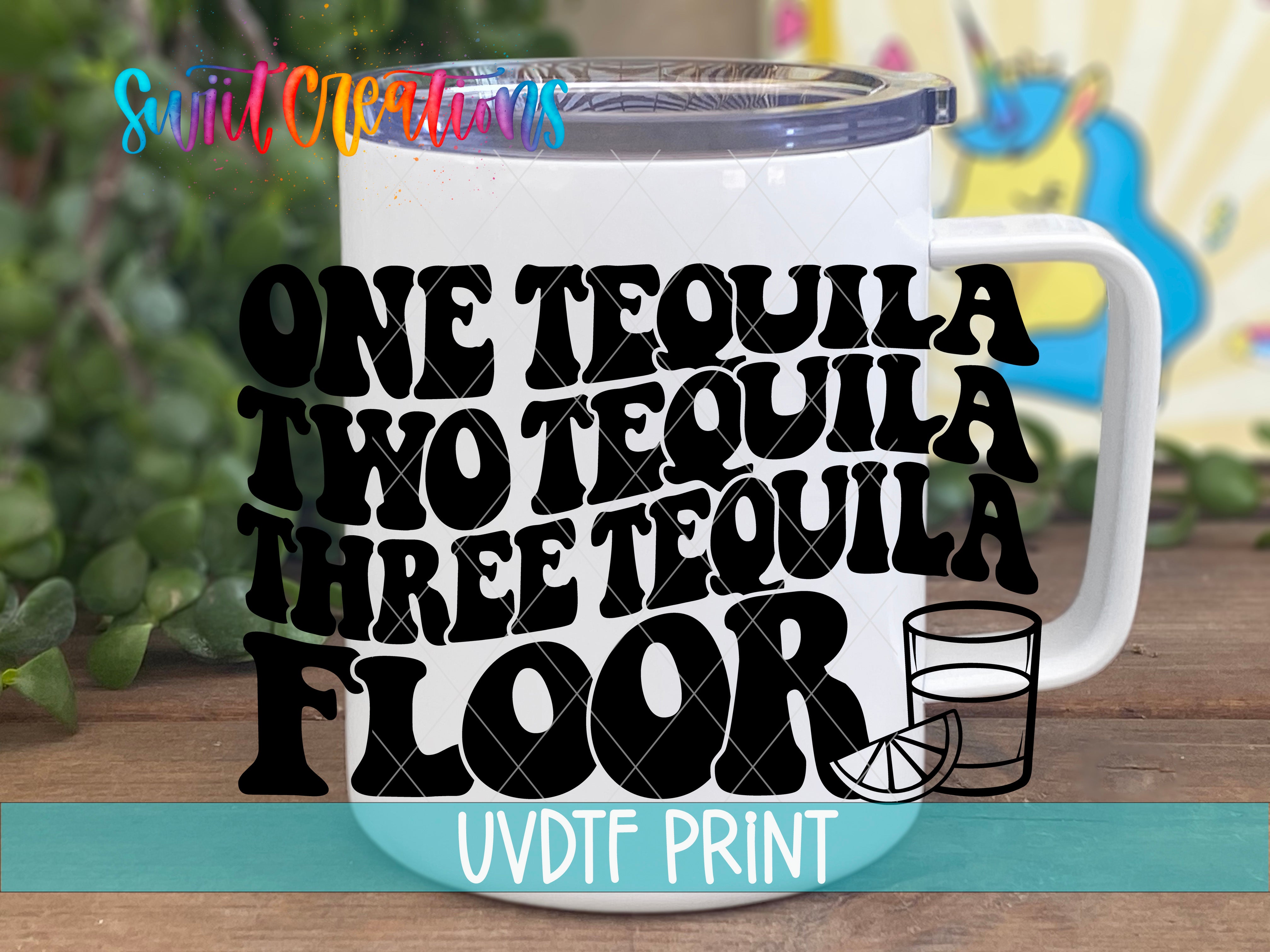 A white mug with the text "ONE TEQUILA TWO TEQUILA THREE TEQUILA FLOOR" printed on it, along with a graphic of a tequila glass and a lime slice.