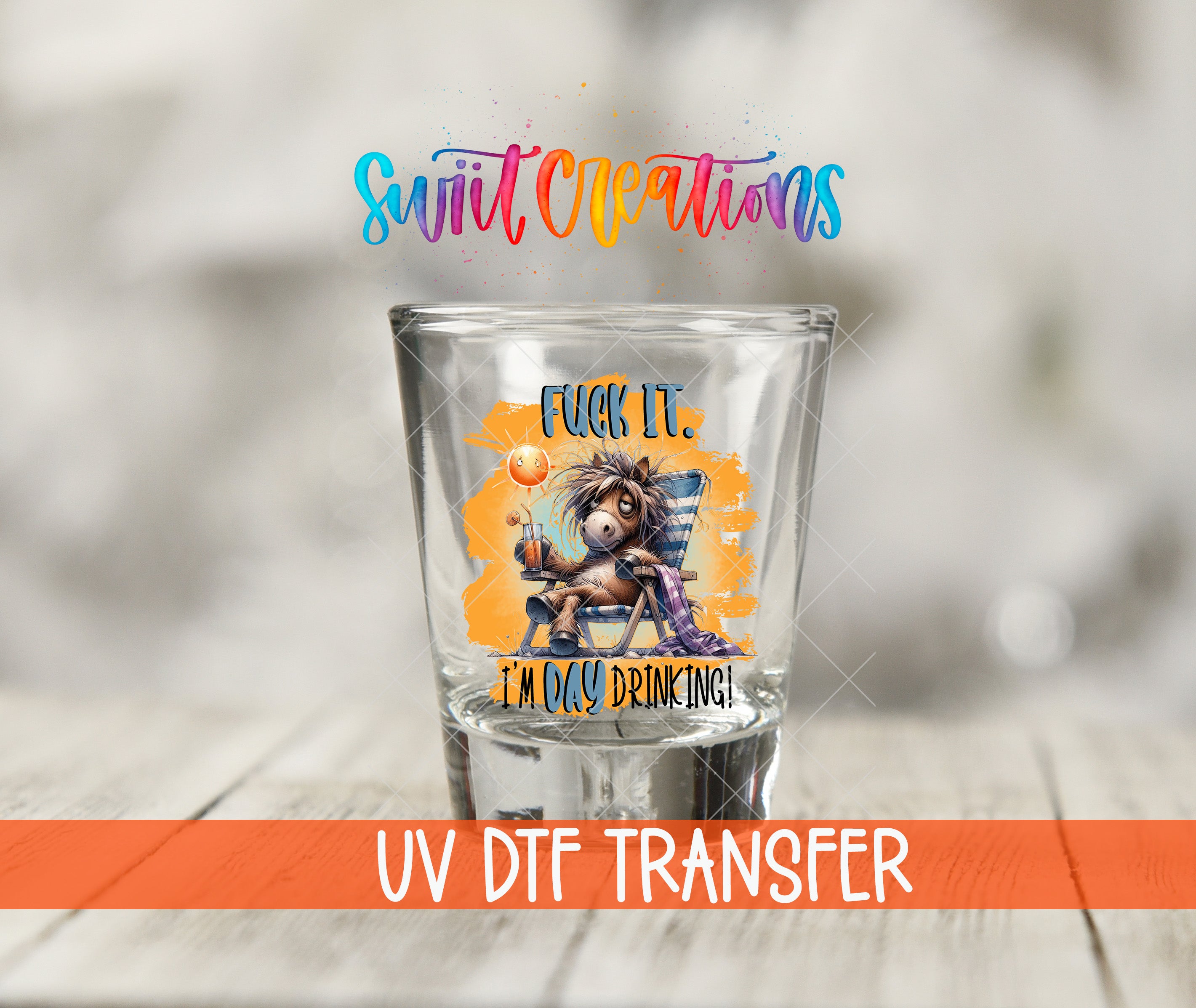 A shot glass with a colorful, cartoonish illustration of a horse and the text "FUCK IT! I'M DAY DRINKING!" printed on it.