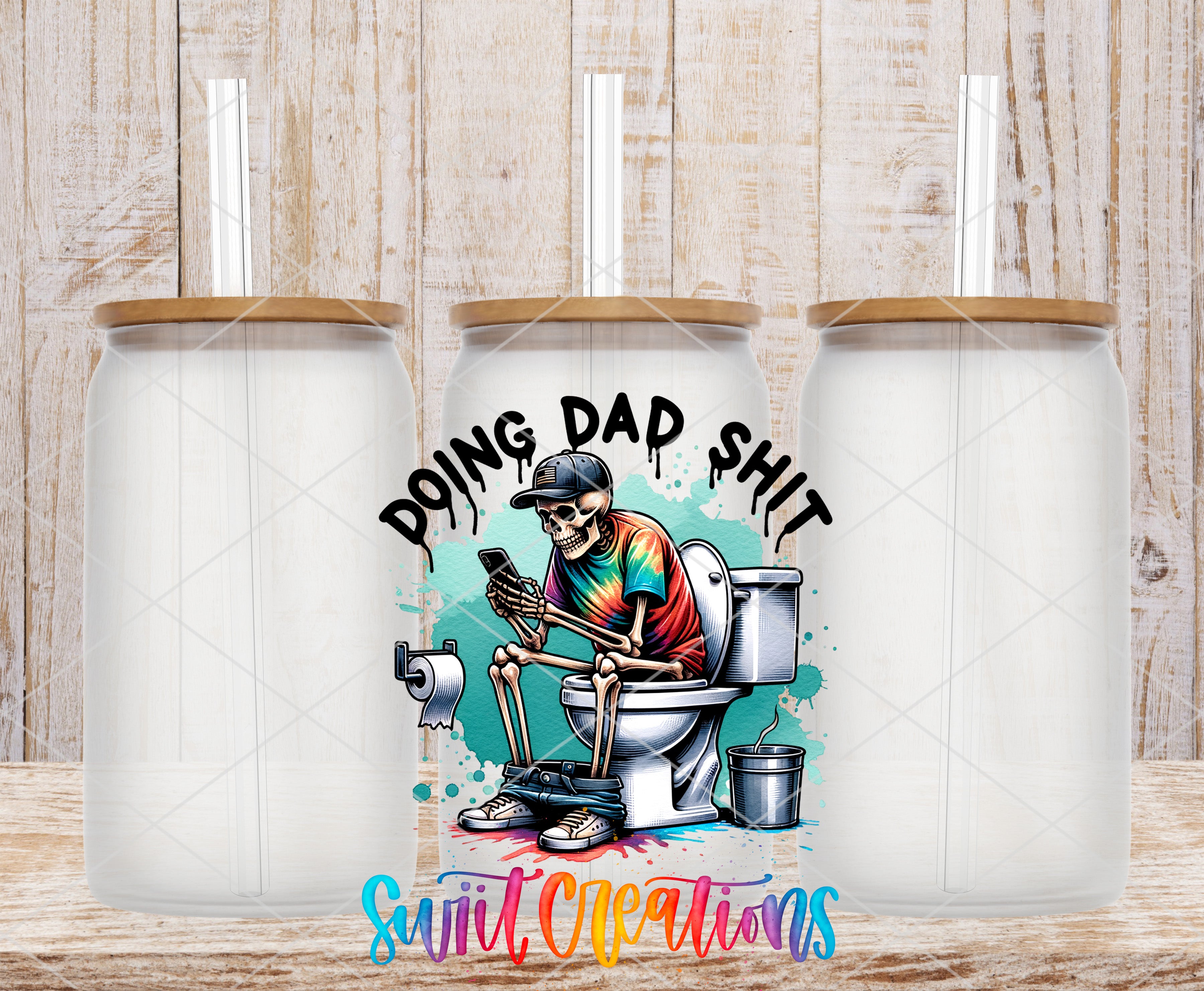 Swiit Creations UV DTF Funny Doing Dad Shit transfer shown on a clear glass can set