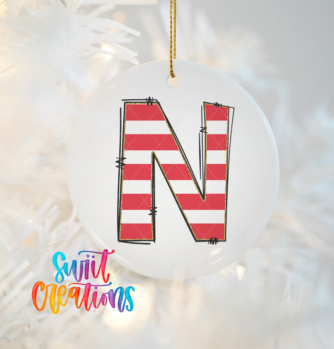 A white ornament with a red and white striped design, resembling a letter "N".
