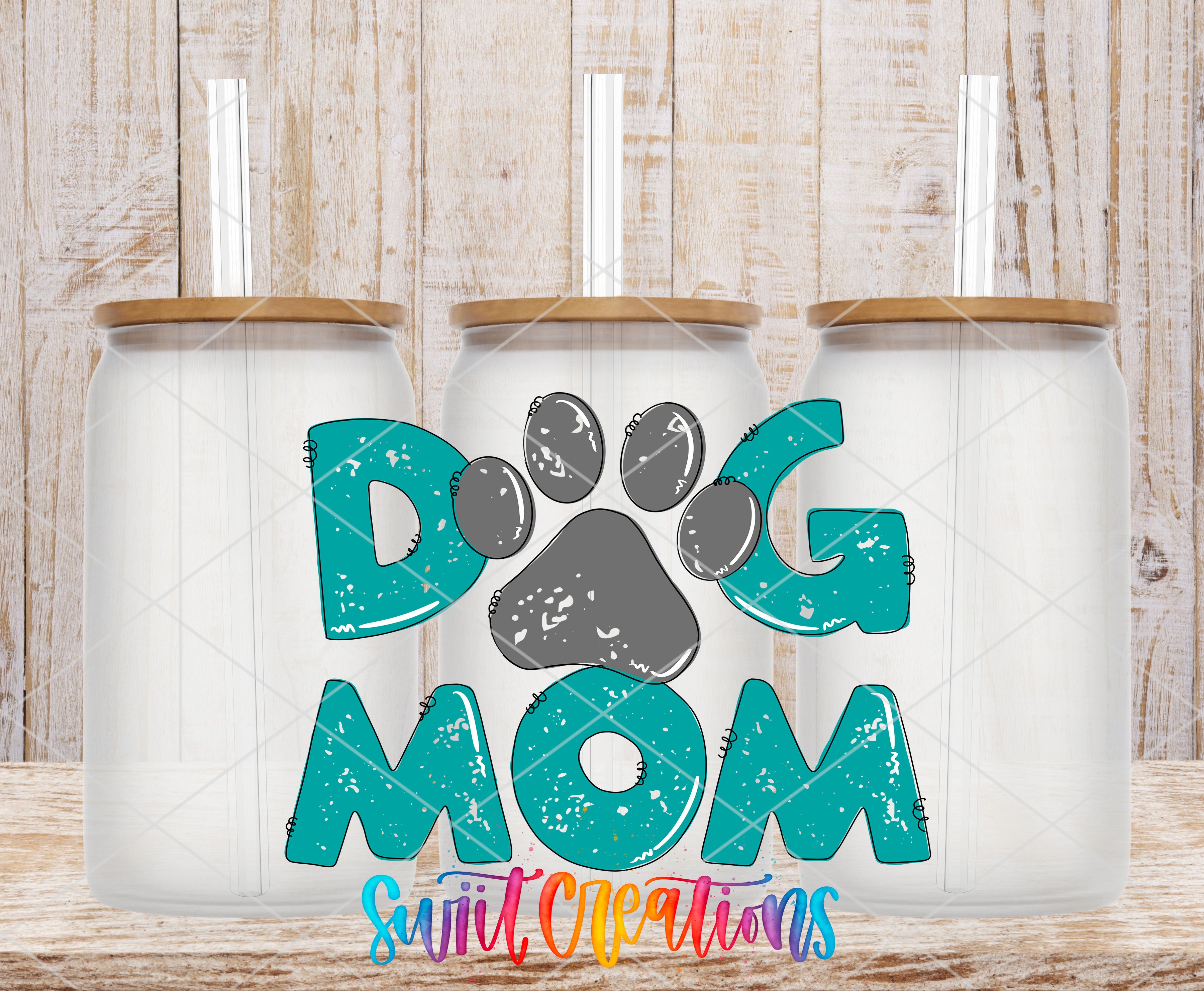 Swiit Creations UV DTF Dog Mom transfer shown on a clear glass can set