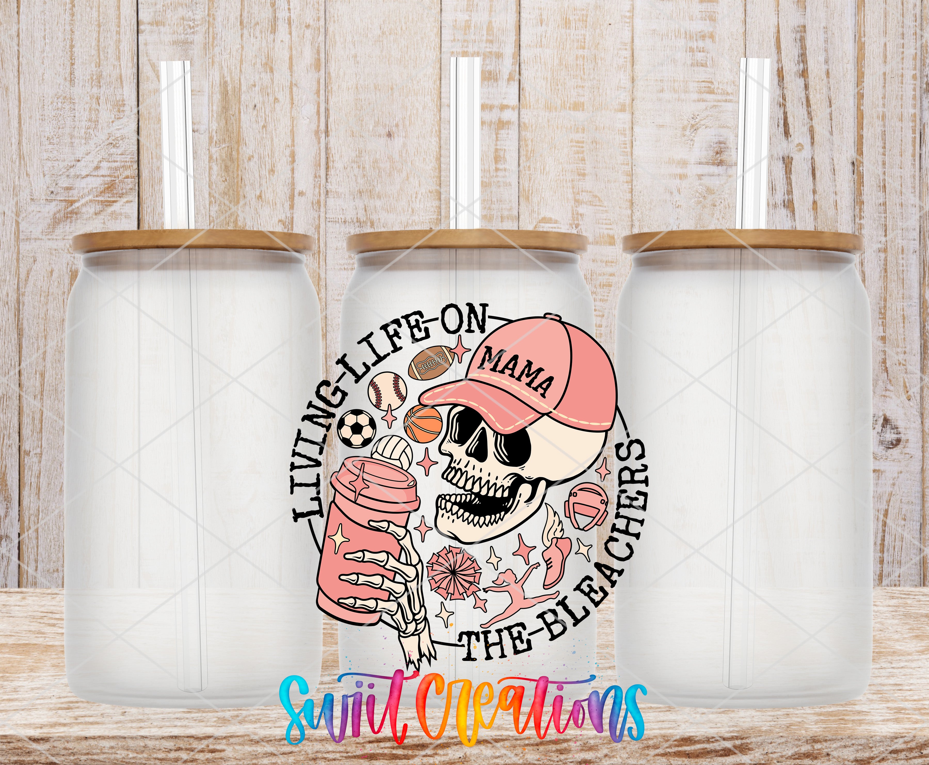 Swiit Creations UV DTF Living Life on the Bleachers transfer shown on a clear glass can set