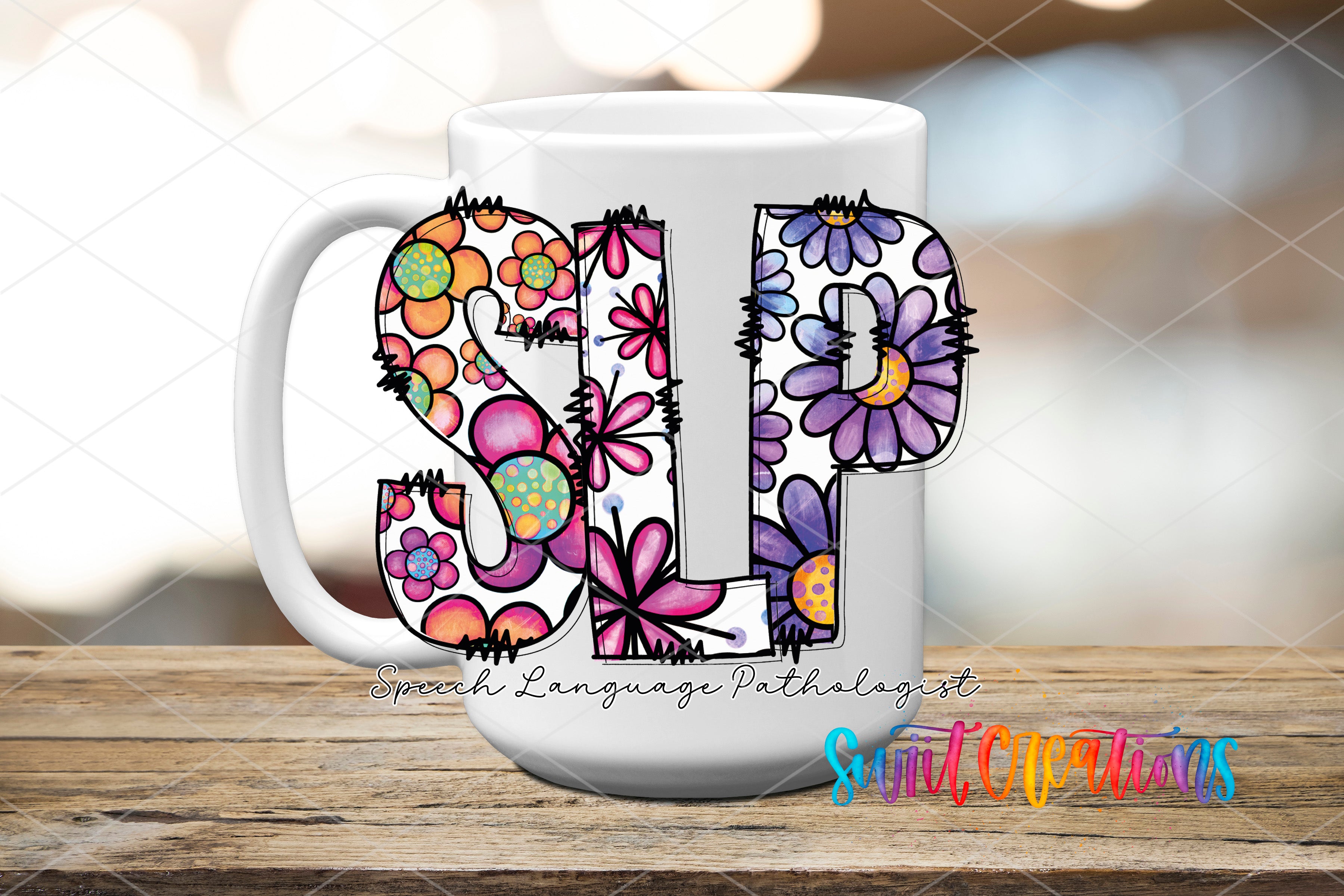 A white mug with colorful floral designs and the text "SLP" printed on it, placed on a wooden surface.