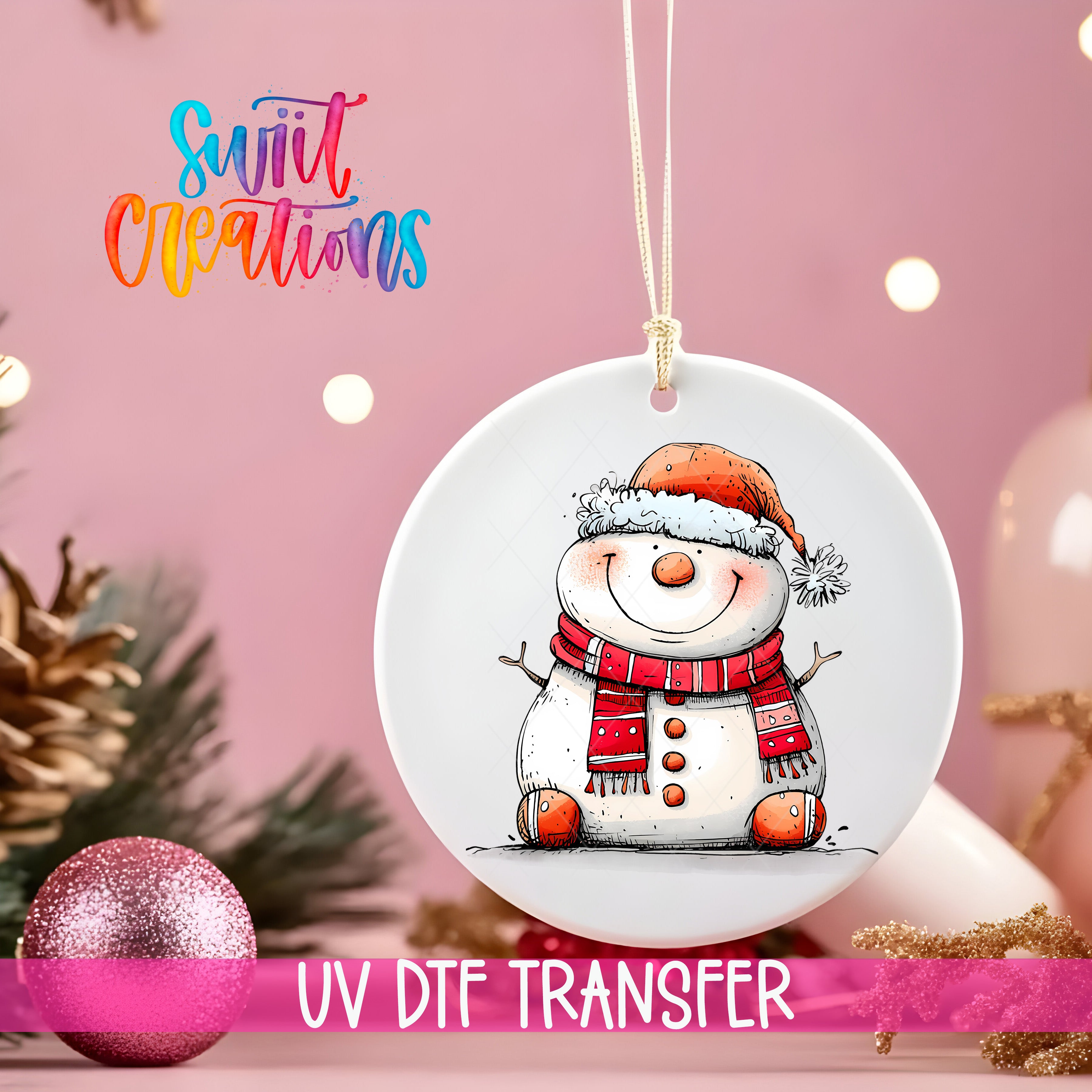 A white ornament with a snowman design hangs against a pink background, with Christmas decorations and a pink ornament visible in the background.