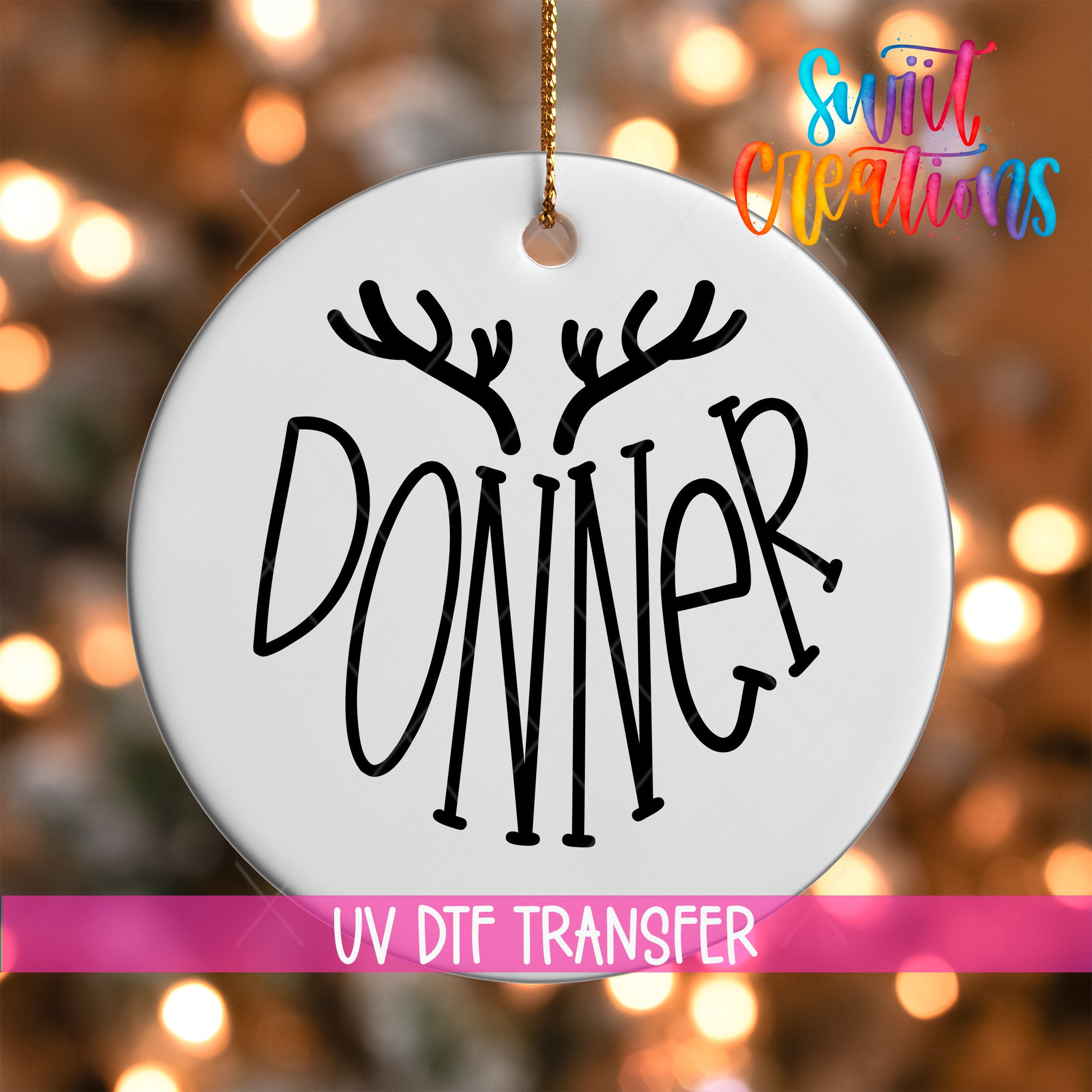 A white ornament with the word "DONNER" written on it, hanging against a background of colorful lights.