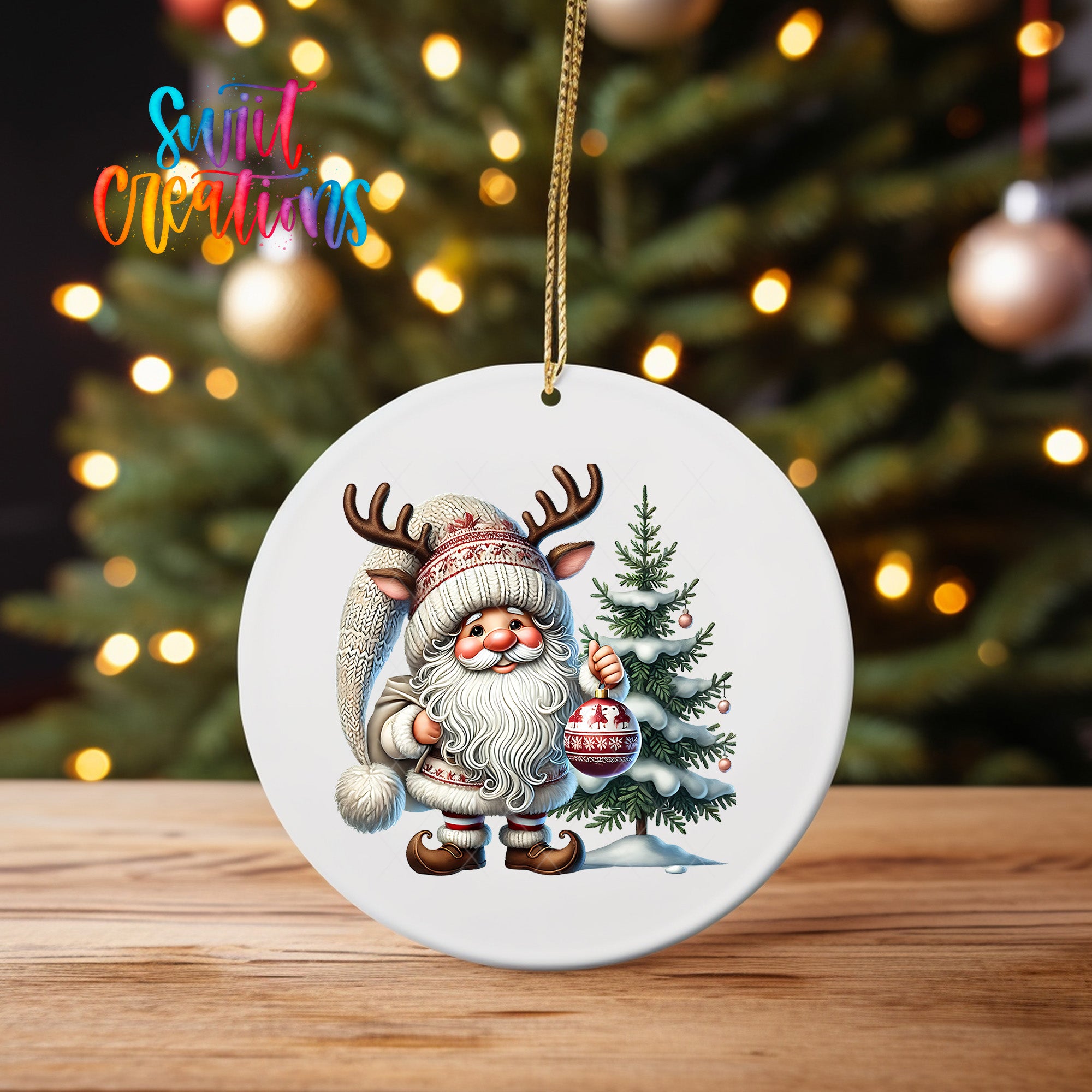 A white ornament featuring a Santa Claus figure with antlers and a Christmas tree, with a blurred background of lights.
