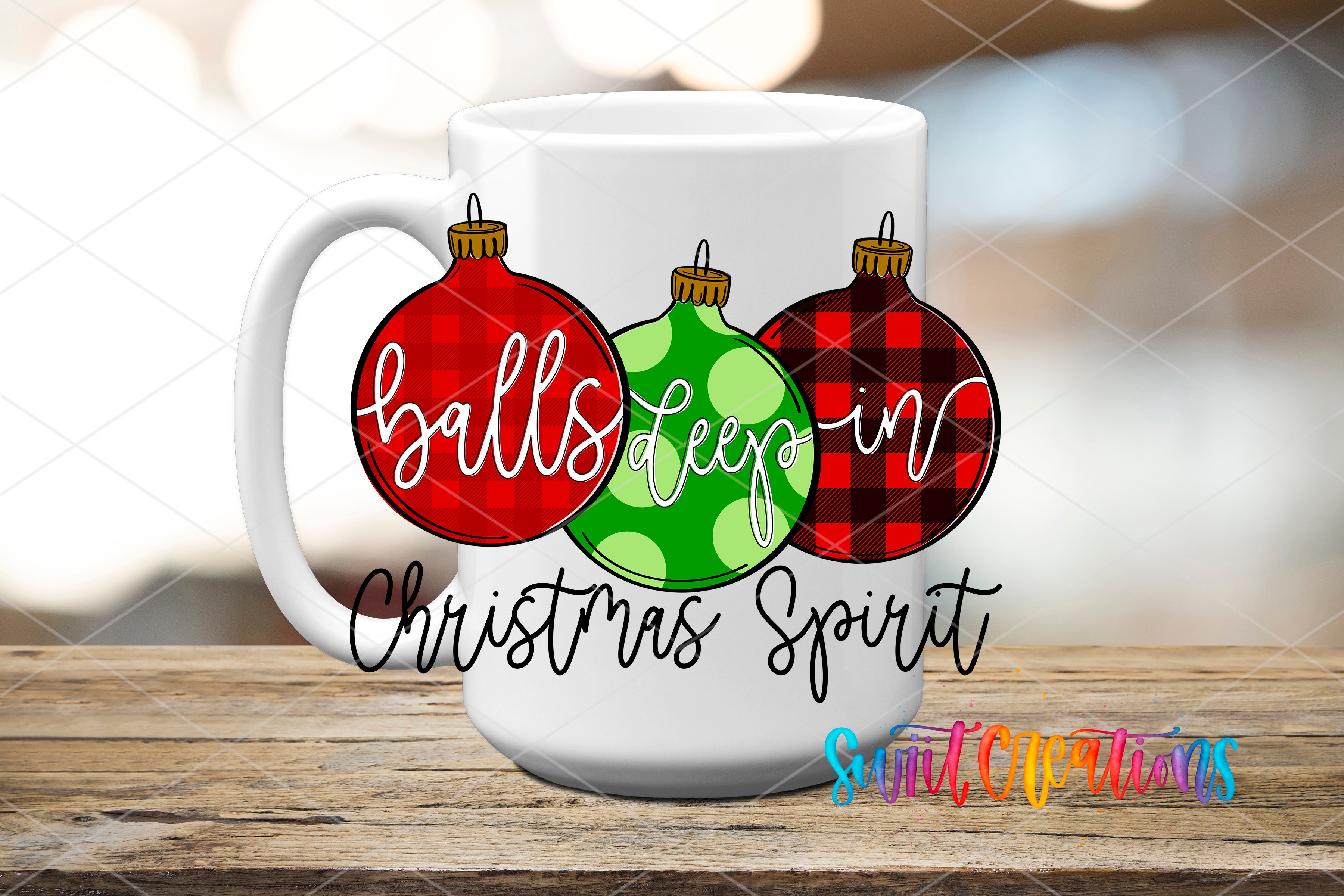 A white mug with a festive Christmas-themed design featuring three Christmas ornaments with the text "balls deep in Christmas spirit" written on them.
