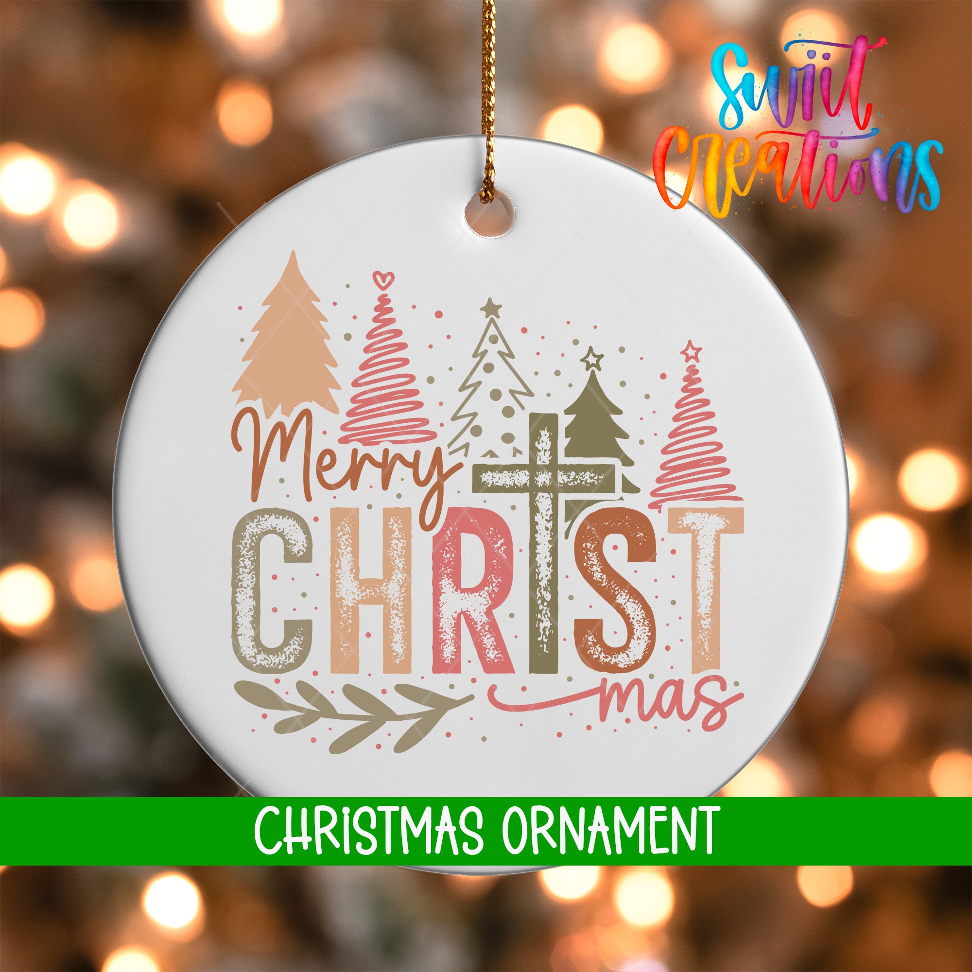 A white Christmas ornament with the text "Merry Christmas" and "Christmas" written on it, hanging against a background of blurred Christmas lights.