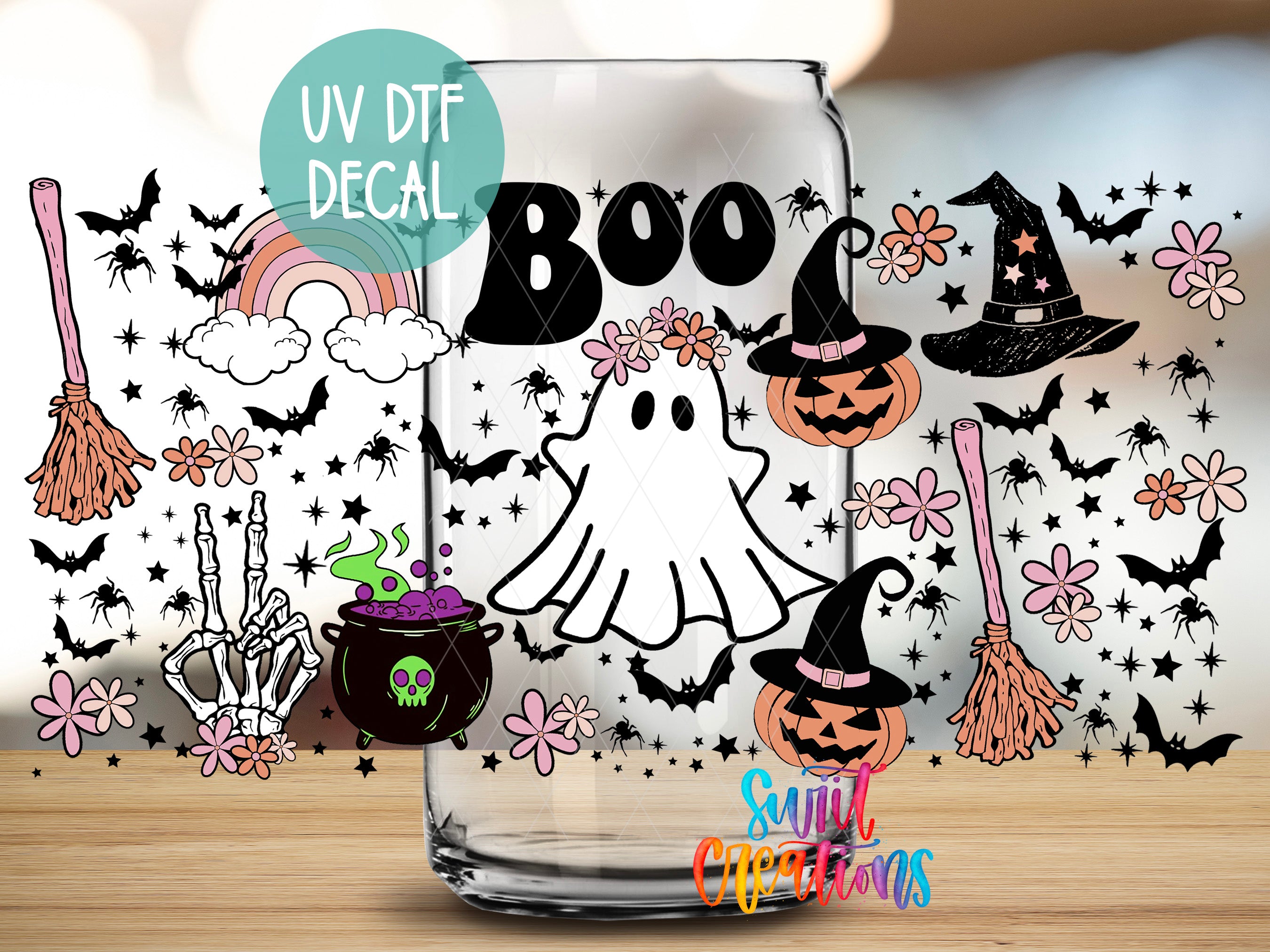 The image is a Halloween-themed decal featuring a ghost, a witch's hat, a pumpkin, bats, flowers, and a rainbow. The text "UV Dtf DECAL" is visible, indicating that the decal is a UV-sensitive design.