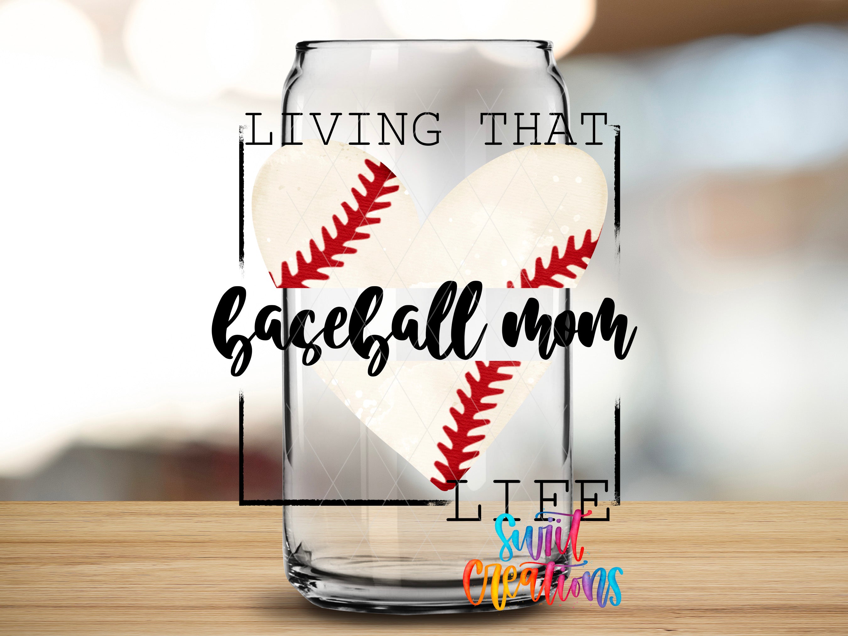 A glass jar with a baseball design and the text "LIVING THAT BASEBALL MOM LIFE" printed on it.