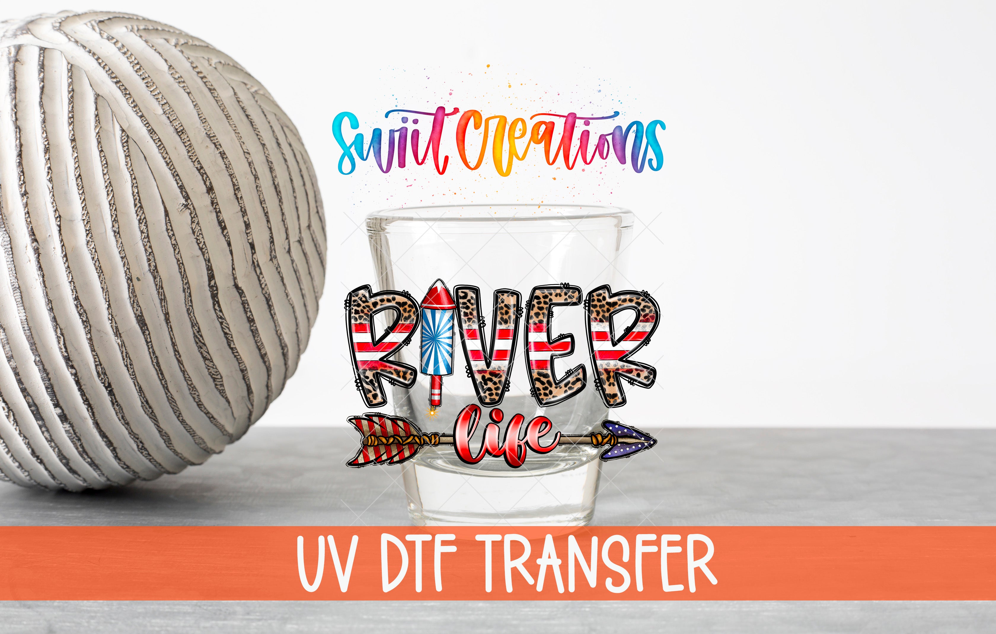 a glass with a colorful design, a white ball, and text related to UV dye transfer.
