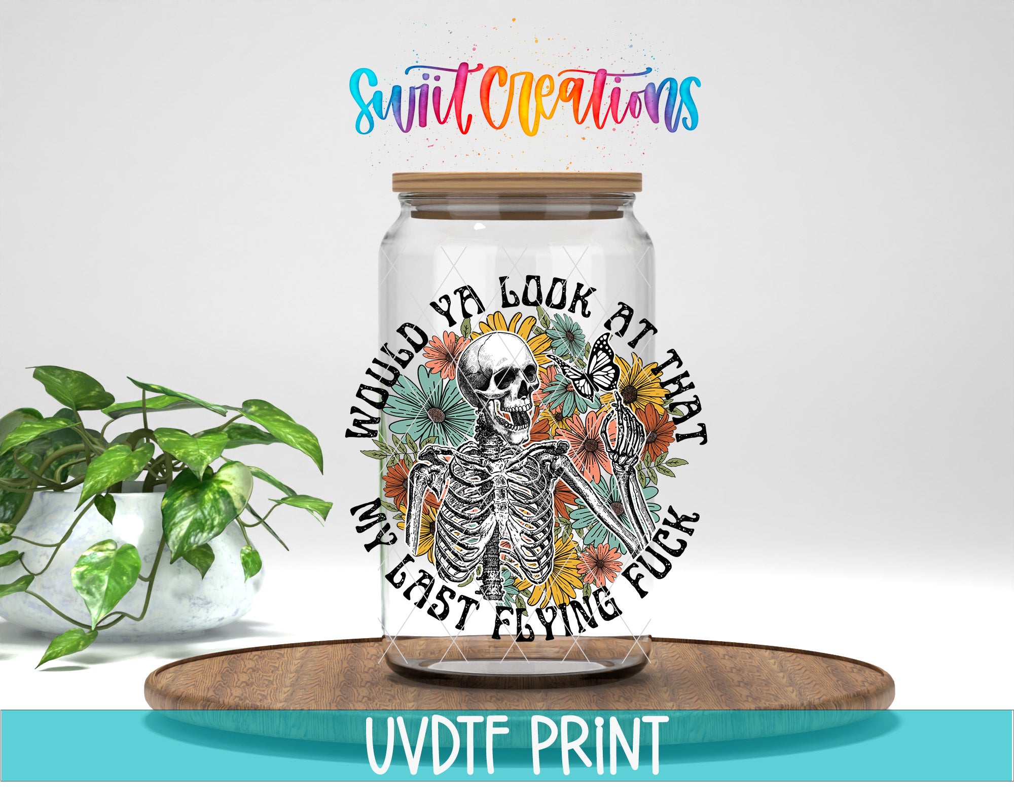 A glass jar with a skeleton and floral design, accompanied by the text "WOULD YA LOOK AT THAT MY LAST FLYING FUCK" and the UVDF (Uvdf) logo.