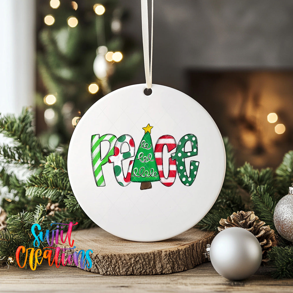A white ceramic ornament with the word "Peace" written on it, surrounded by Christmas decorations such as pine branches and ornaments.