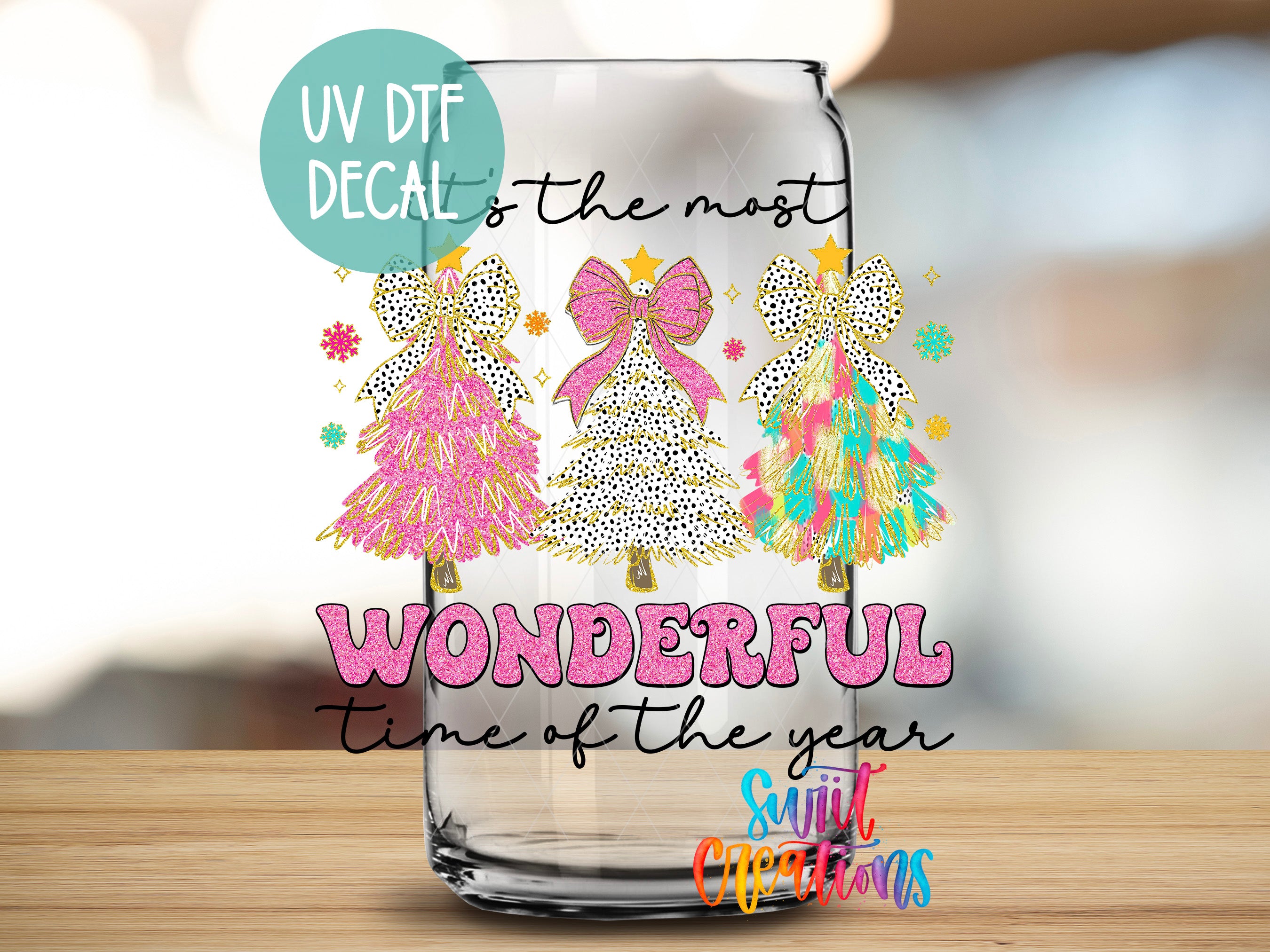 a glass with a picture of christmas trees on it