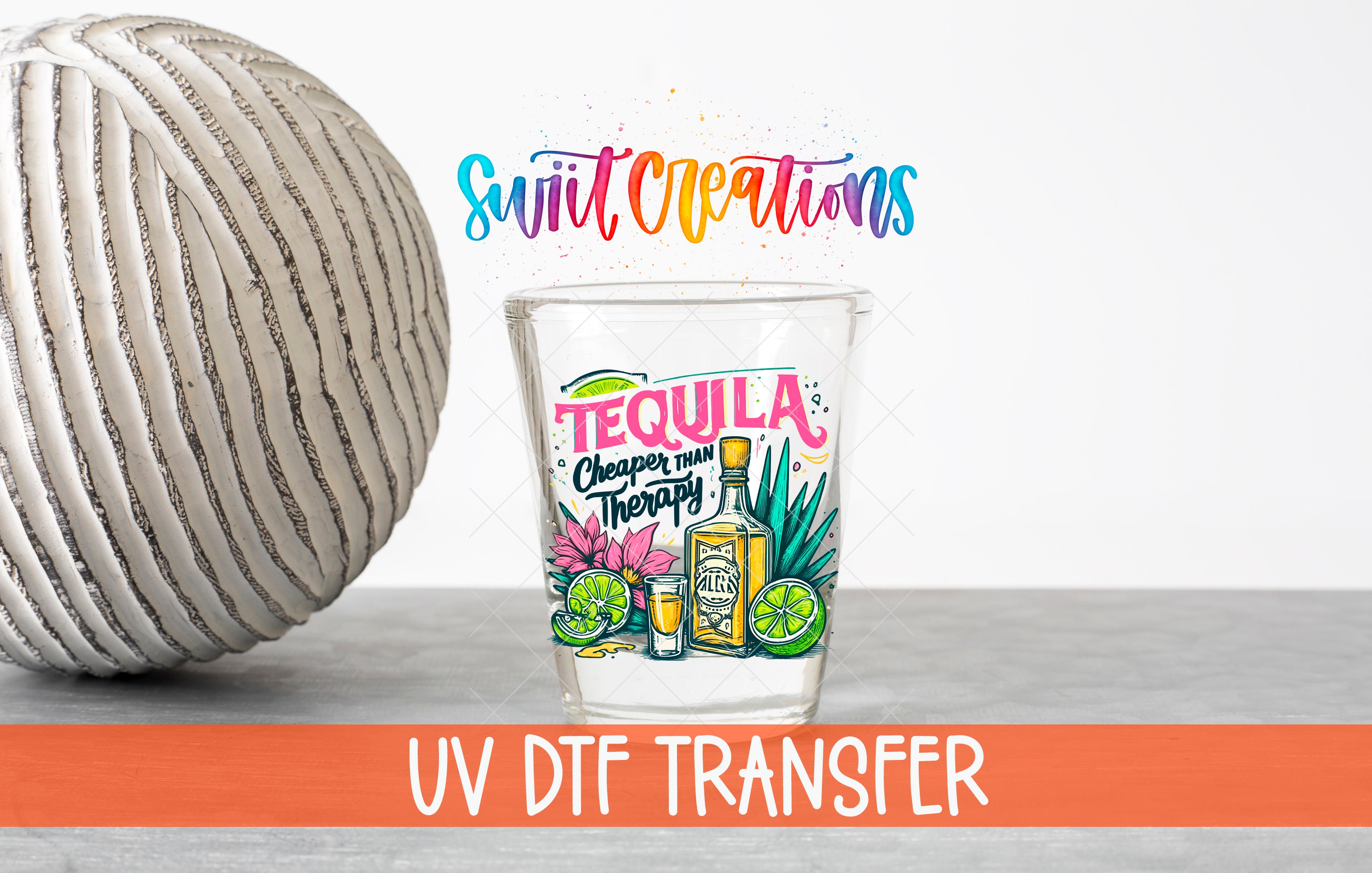 a tequila-themed glass with a colorful design, placed next to a gray ball and a text overlay that says "Swit Creations UV Dtf Transfer".