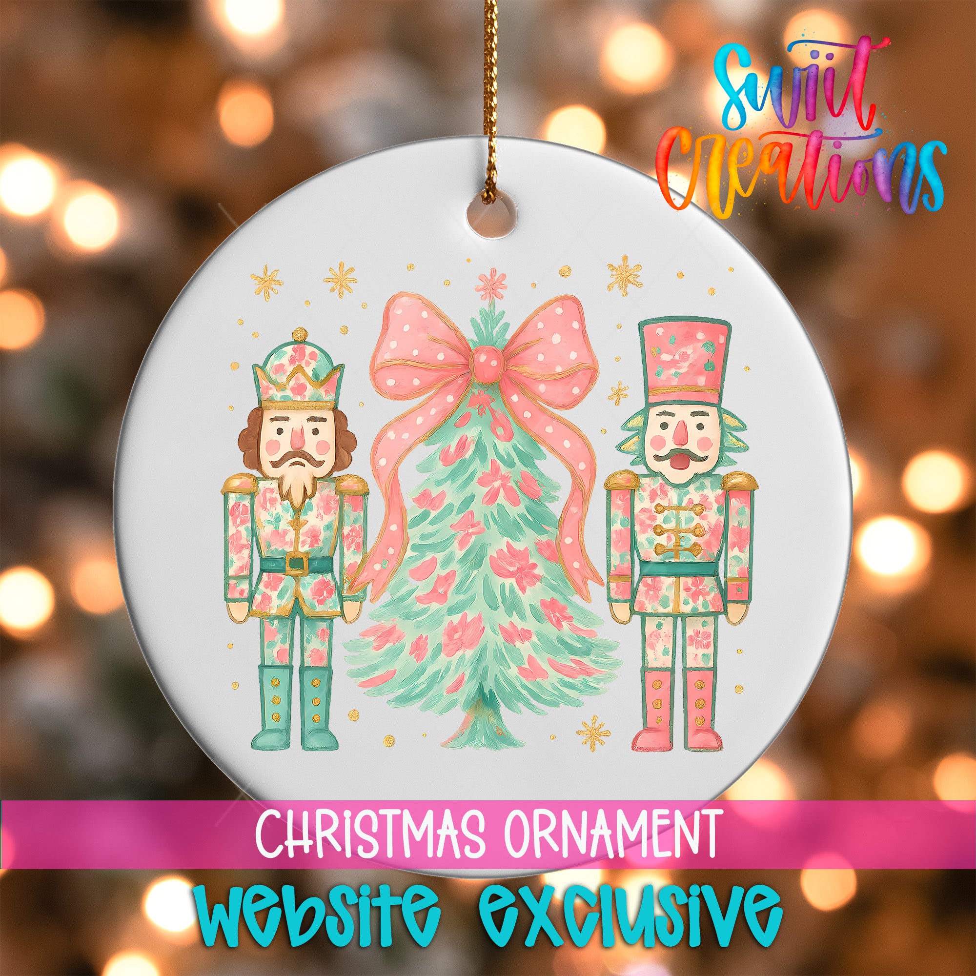 The image is a Christmas ornament featuring two nutcracker men and a Christmas tree, with a pink bow and snowflakes.