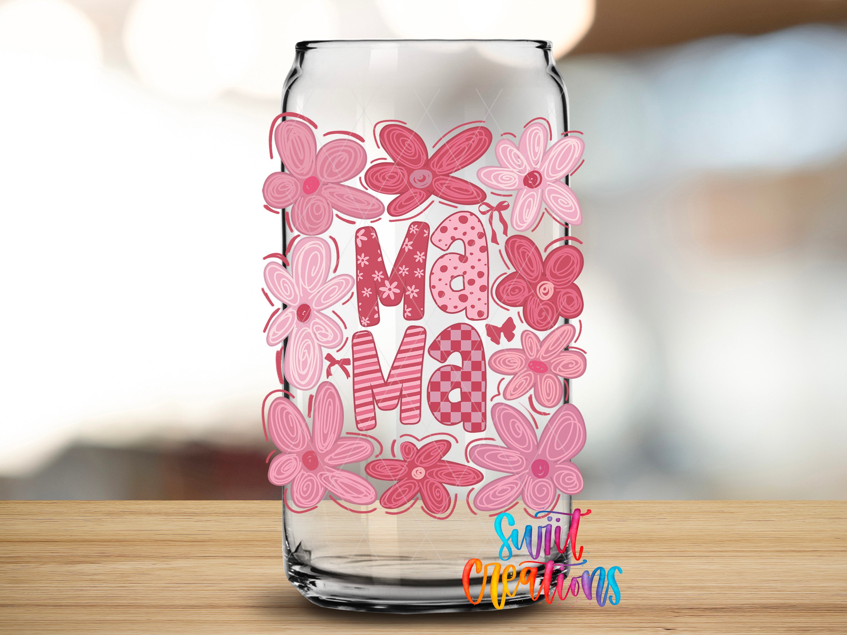 A glass jar with a floral design and the word "Mama" written on it.