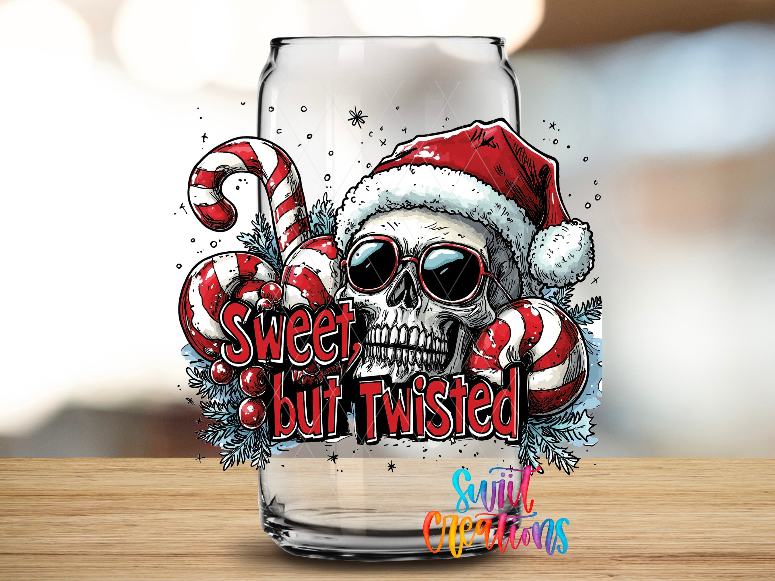 A glass with a skull wearing a Santa hat and sunglasses, surrounded by candy canes and berries, with the text "Sweet but Twisted" and "Sign of the season" written on it.