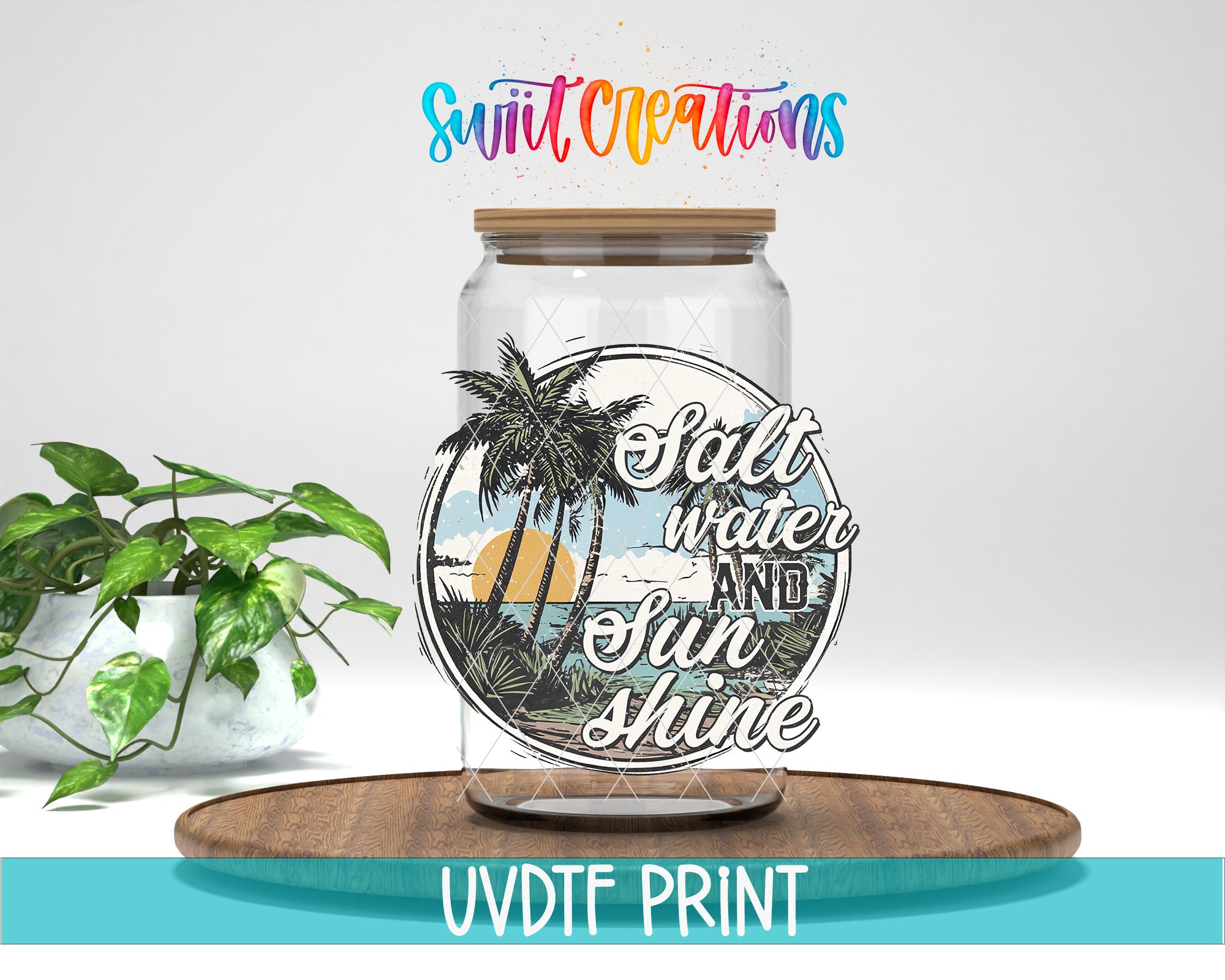 a glass jar with a tropical beach scene and the text "Salt water and sun shine" printed on it, placed on a wooden surface.