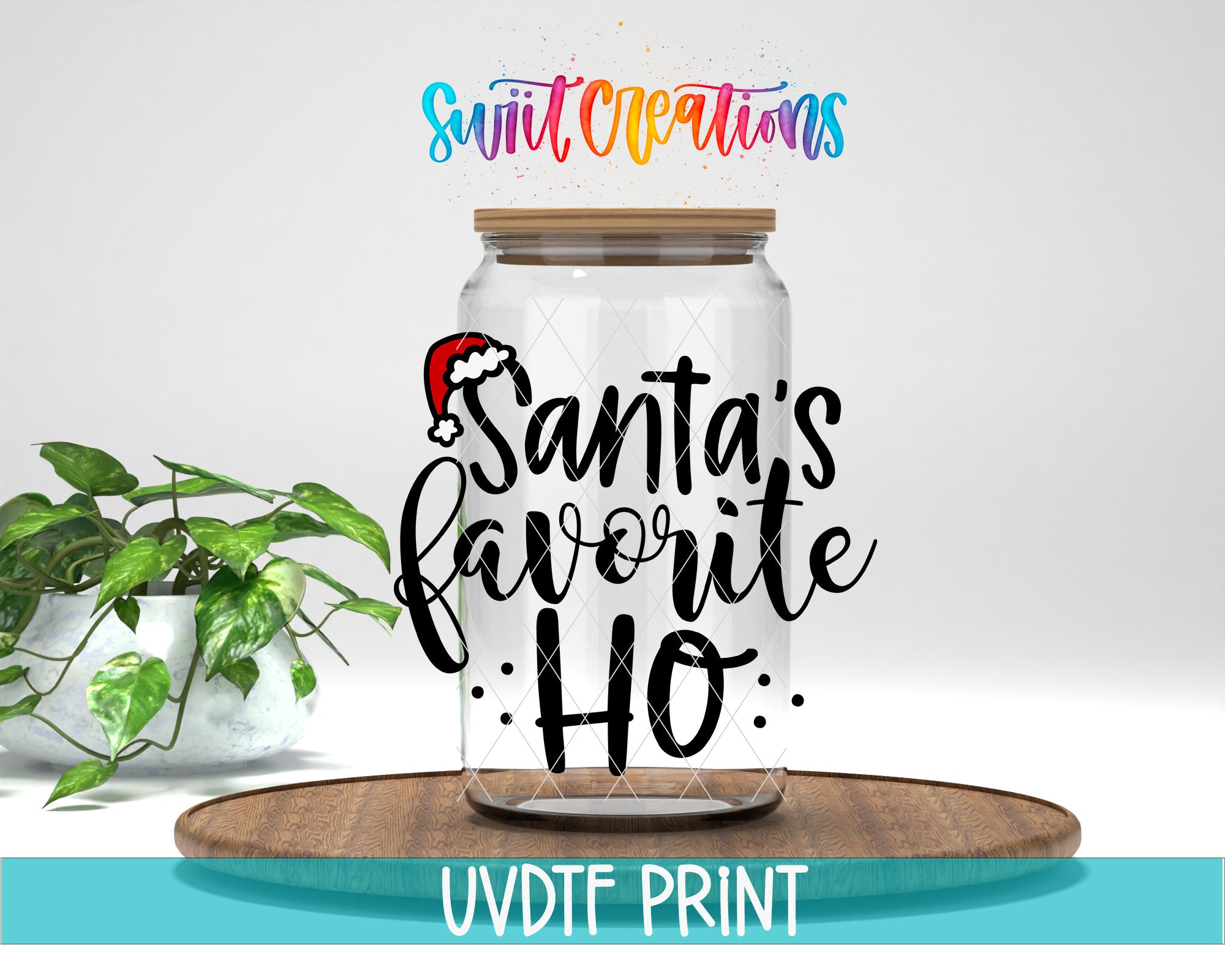 a clear glass jar with a Santa hat on it, placed on a wooden surface. The jar has a label that says "Santa's favorite ho". There is also a plant in the background.